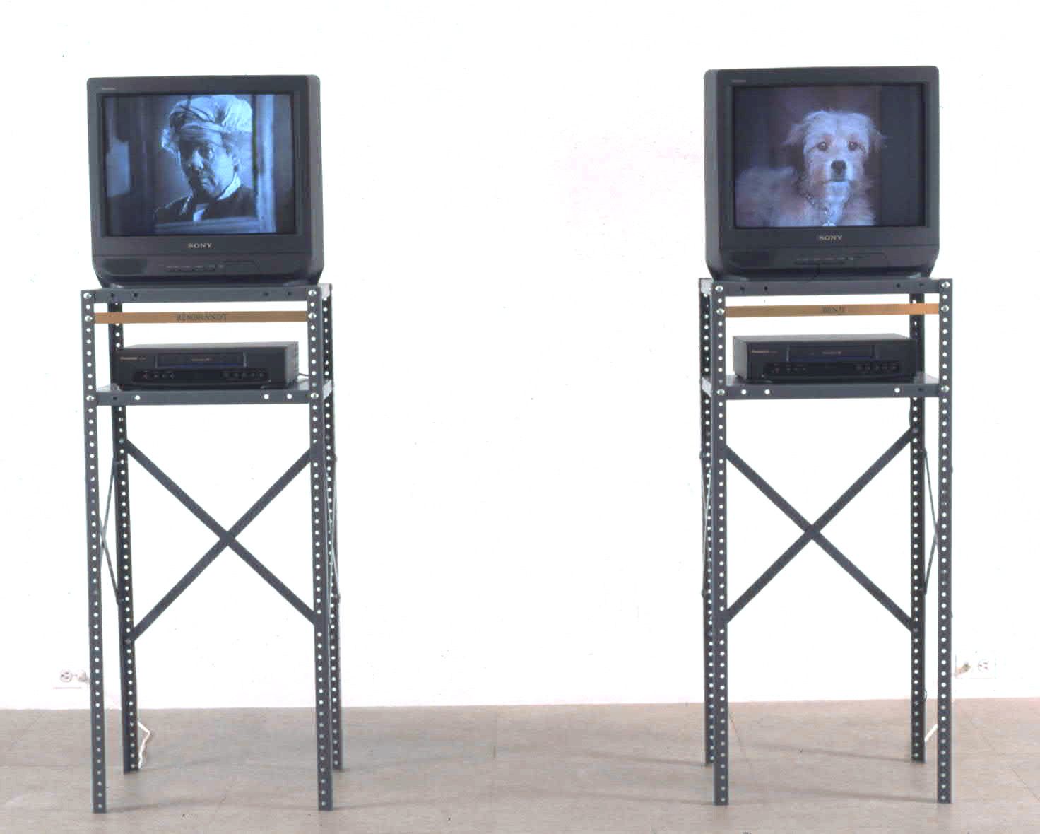 Jonathan Horowitz, Dot, 1998, 2 VHS tapes and 2 metal shelves, dimensions variable