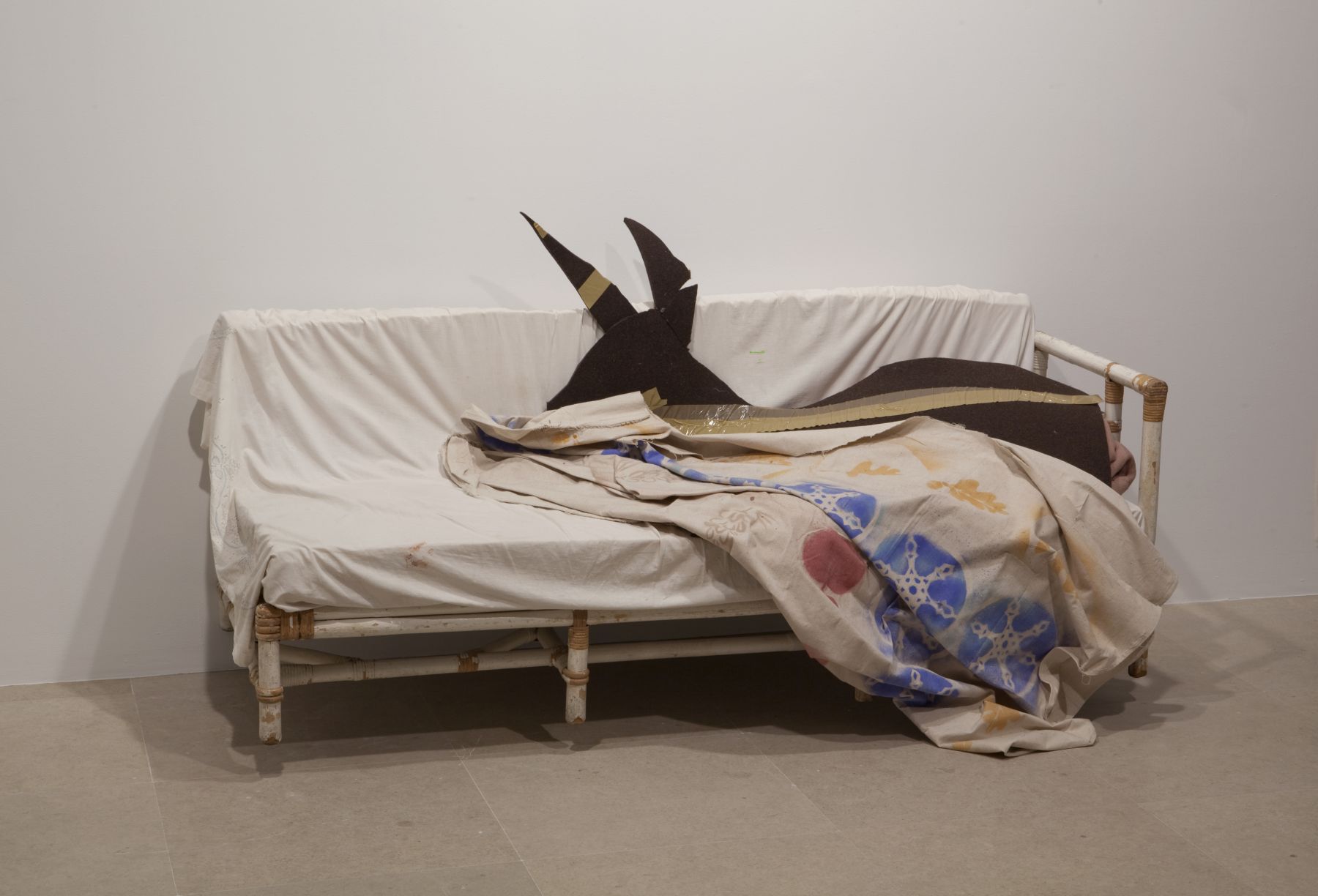 Gedi Sibony (with Diana Lyon), Who Attracts All That is Named, 2010, couch, bed sheet, wool blanket, felt, tape, canvas and spraypaint, dimensions variable
