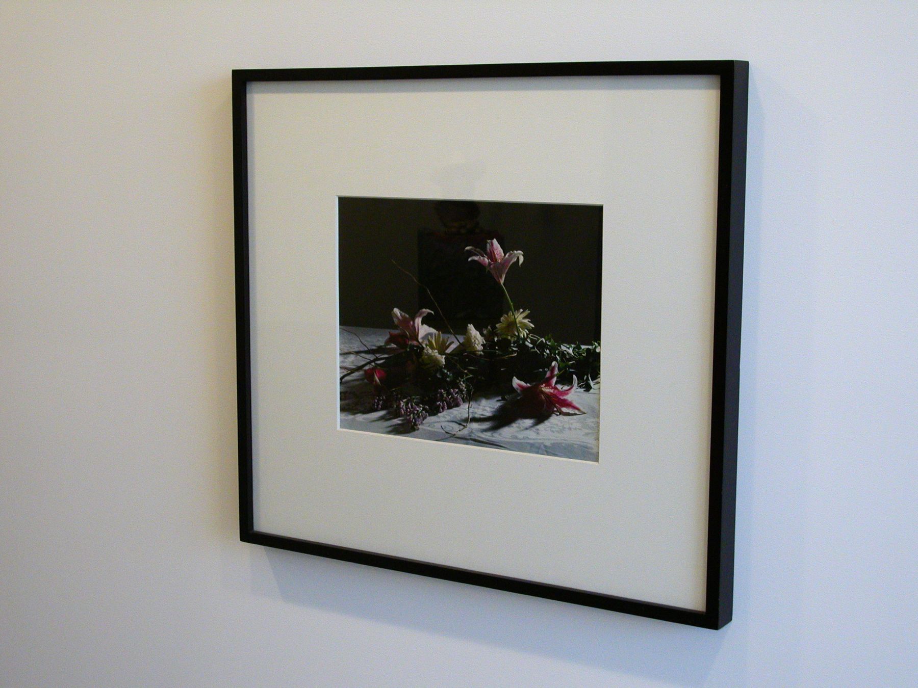 Christopher Williams, Bouquet, for Bas Jan Ader and Christopher D’Arcangelo, 1991 (detail), Archival corrugated board, archival photocorners, compound, 4-ply conservamat, 8-ply conservamat, drywall, dye transfer print, glass, lacquer-based finish, linen tape, nails, Northern maple, plastic set back strips, primer, screws, seaming tape, paint and wood, Print: 16 x 20 inches, Wall: 120 x 180 x 6 ¾ inches