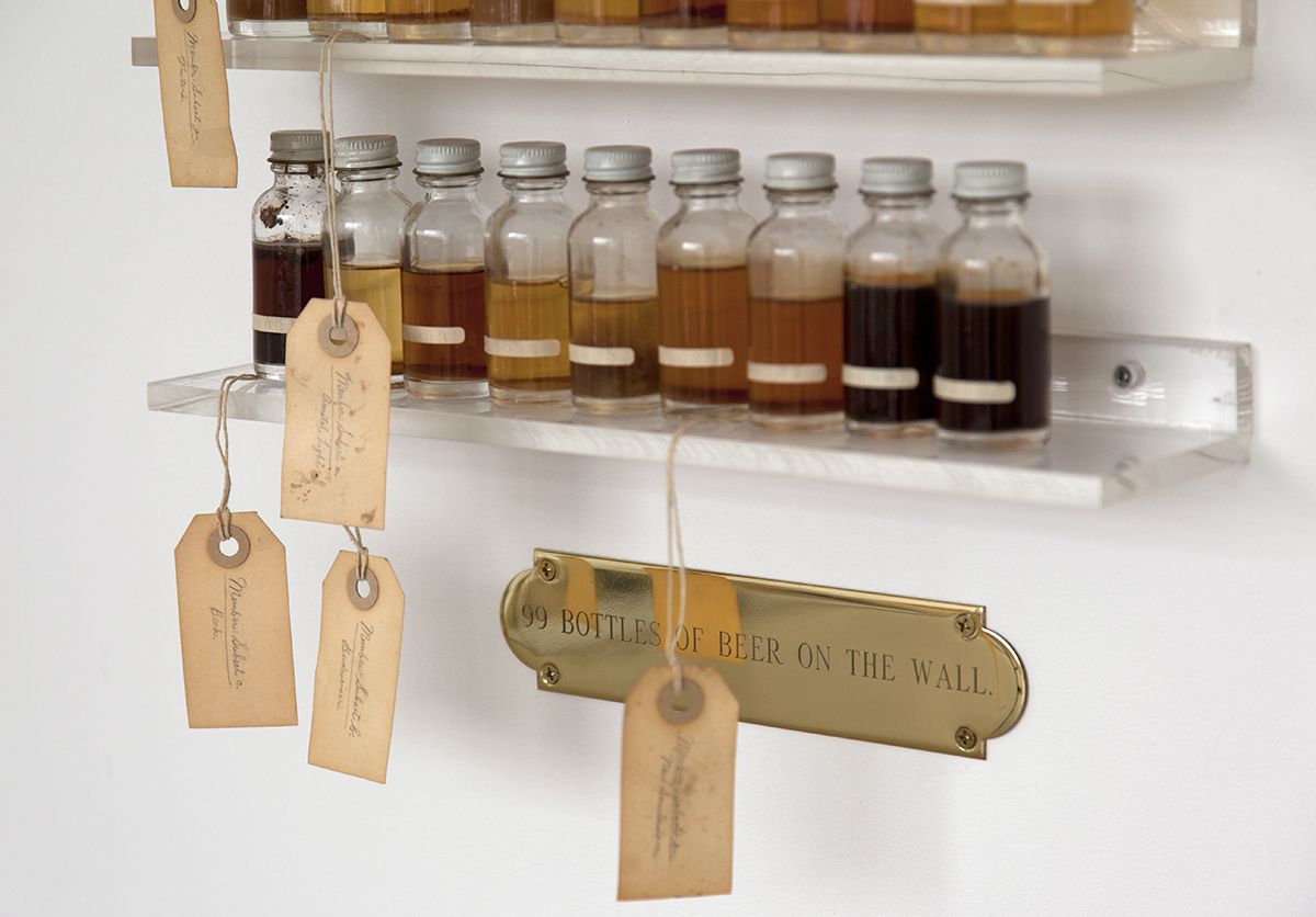 Candy Jernigan, 99 Bottles of Beer on the Wall, detail, c. 1988-89, Beer, glass vials, packing tags, and Plexiglas shelves, 48 x 14 x 3 1/2 inches (121.9 x 35.6 x 8.9 cm)