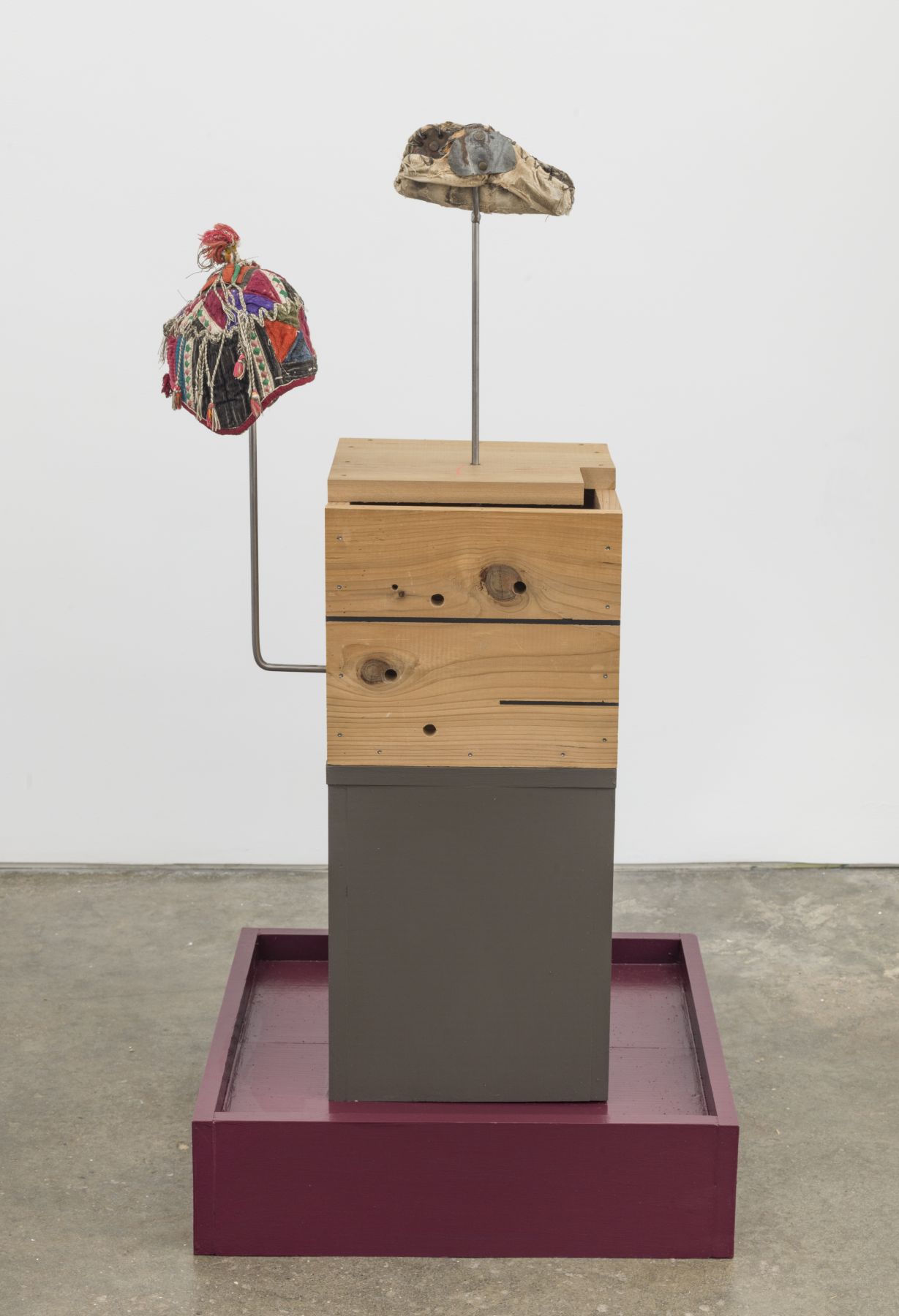 Untitled, 2018, Chinese baby hat, metal welder glove, wooden bases