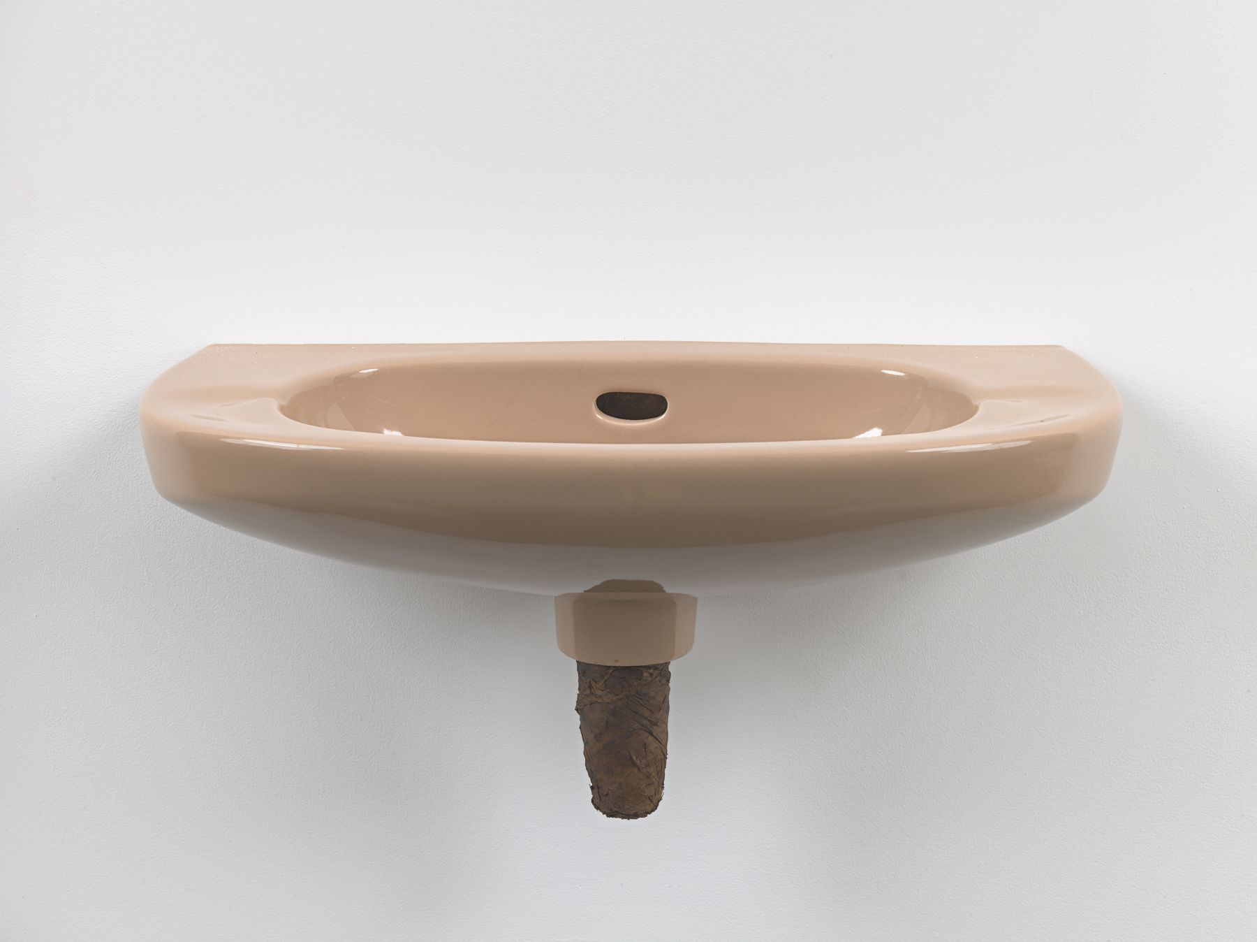 Plug, 2018. Ceramic sink, hand-rolled cigar,
