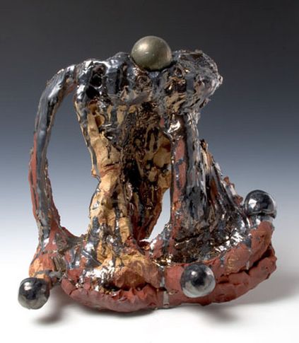 Pyrite Fourchette, 2007. Ceramic, bronze sphere, formica pedestal. Sculpture - 16 x 17.5 x 5 inches (40.6 x 44.5 x 12.7 cm); pedestal: 40 x 25 x 17 inches (101.6 x 63.5 x 43.2 cm). MP 38