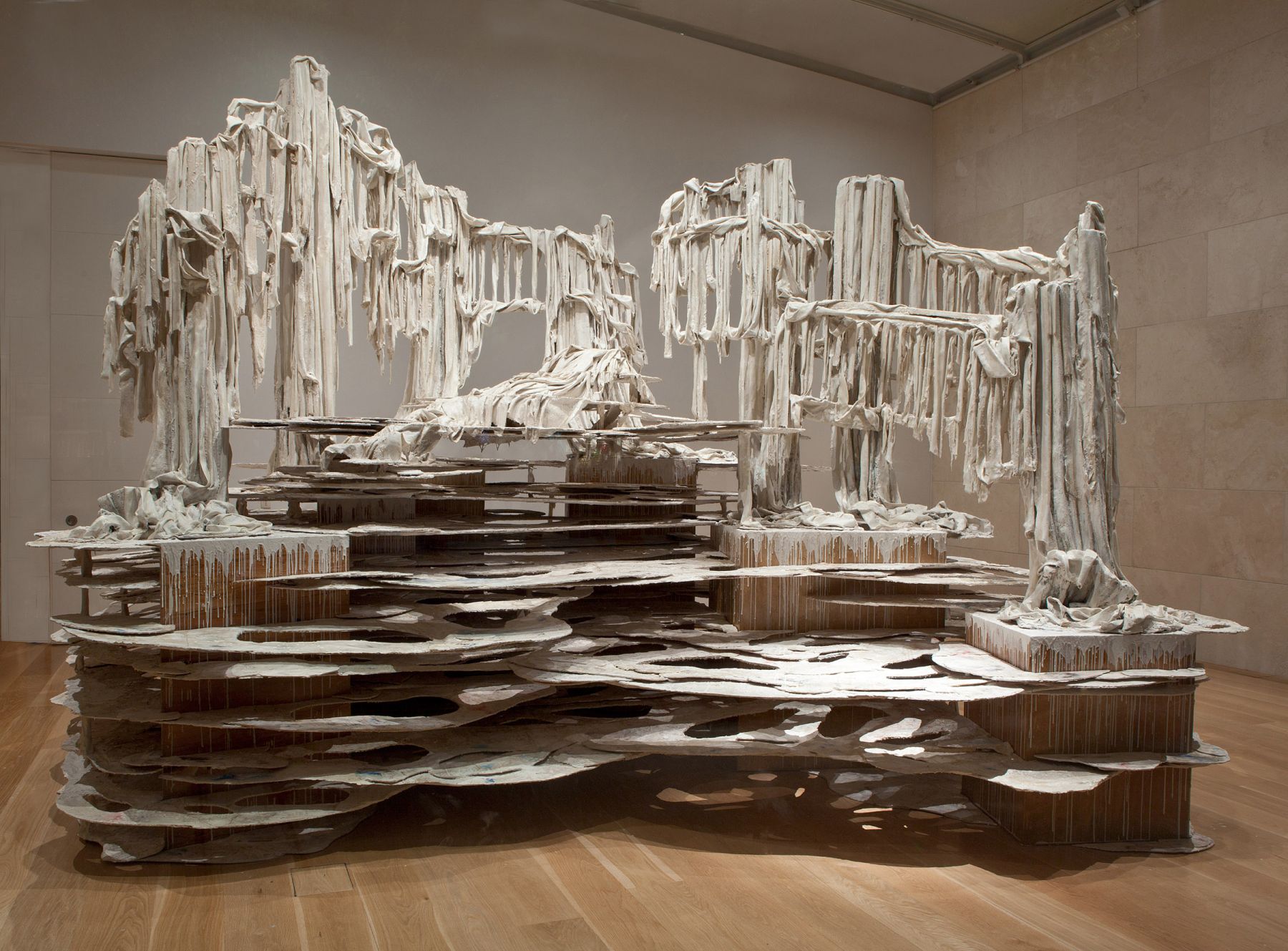 a large installation sculpture of dripping forms by Diana Al-Hadid