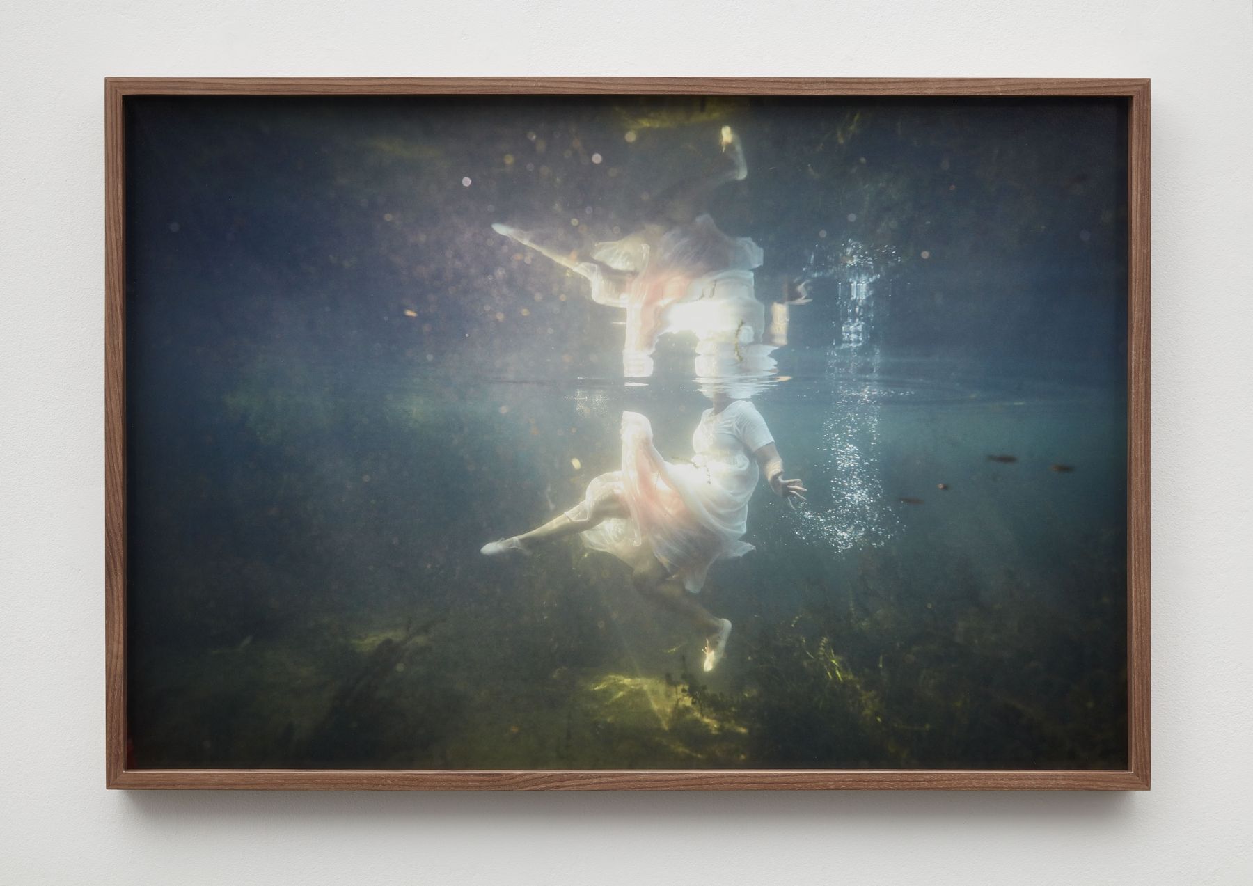 Photograph of figure in white dress underwater by Allison Janae Hamilton