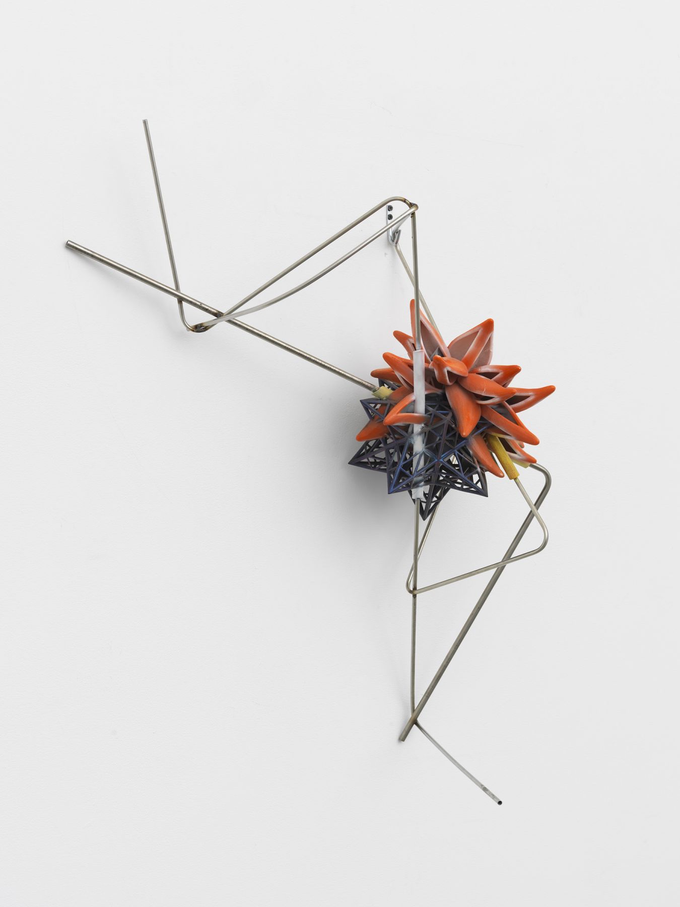 a colorful 3-d printed artwork by frank stella on view in a chelsea art gallery