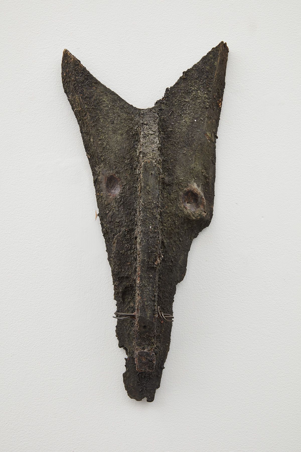 a wood and iron sculpture that looks primitive by jay heikes an artist from minnesota