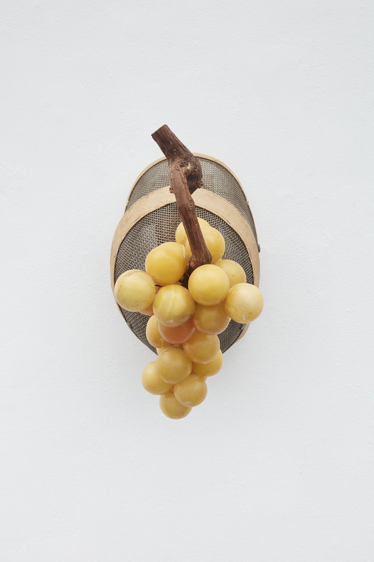 Fencing mask with round objects attached by Allison Janae Hamilton
