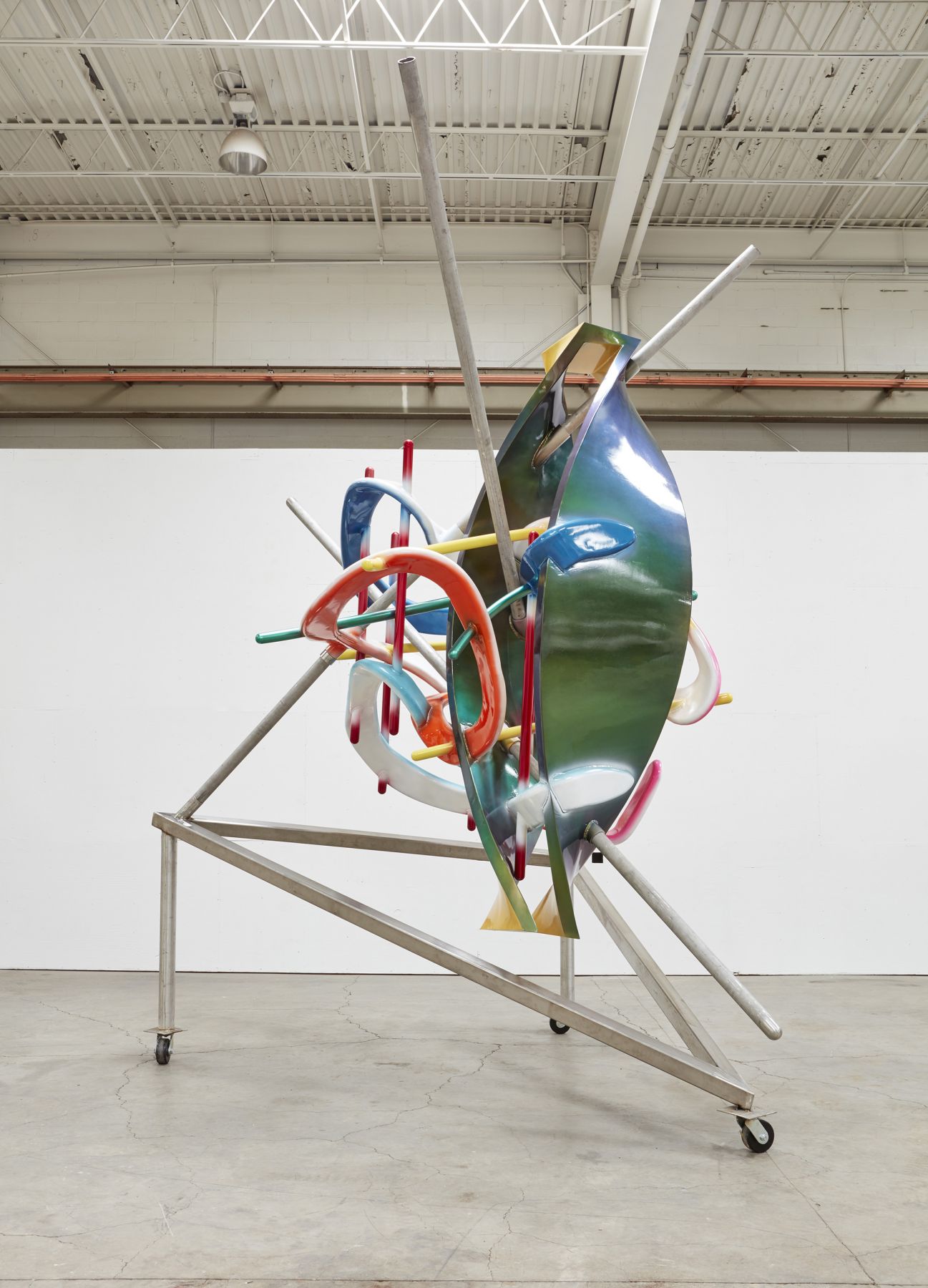 a sculpture of twisted lines and neon paint by the american artist frank stella
