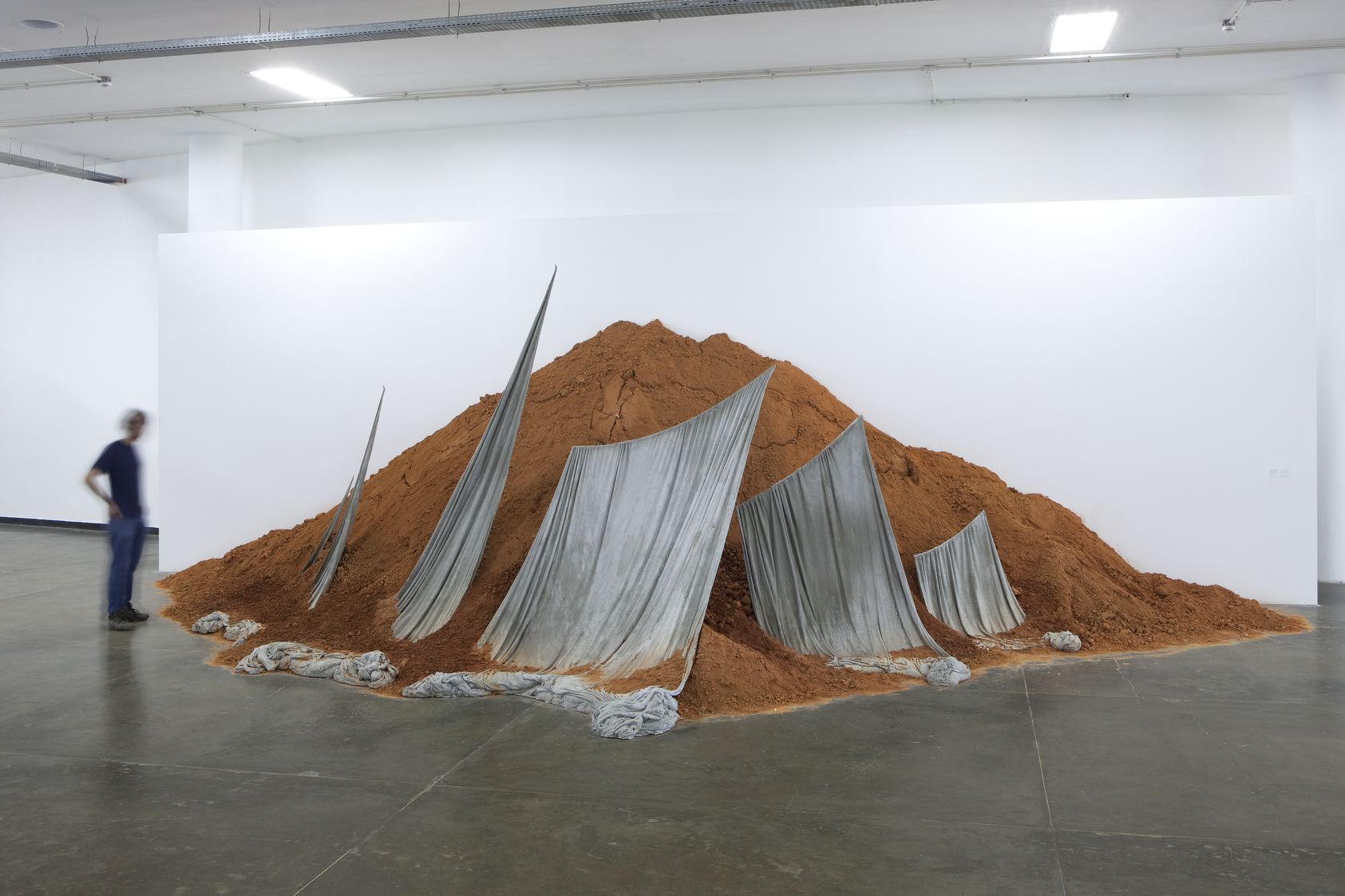 an installation with soil and sails by contemporary artist thiago rocha pitta