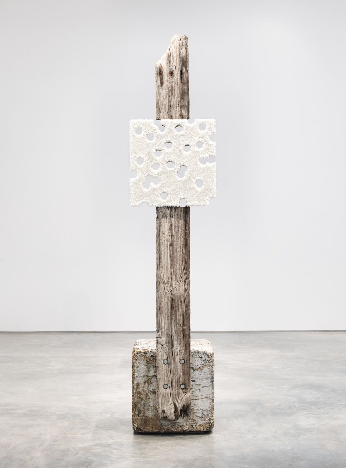 a glory hole white painting set on a piece of driftwood to make a sculptural artwork by donald moffett