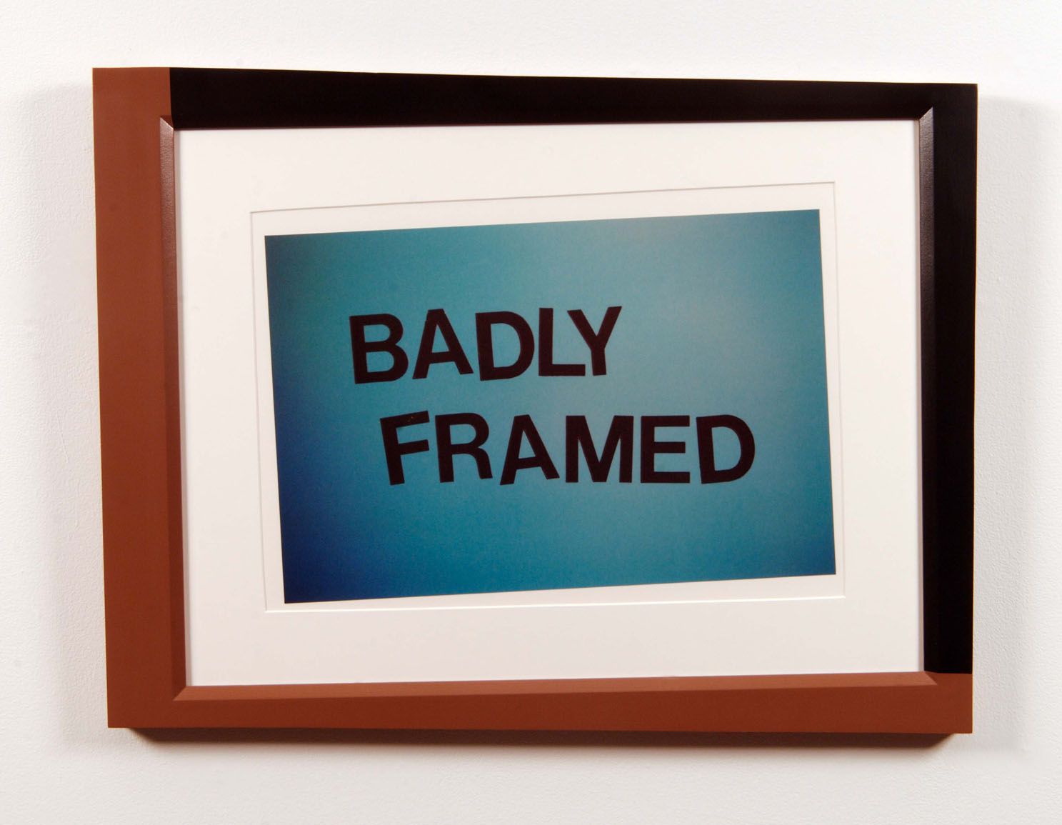 crookedly framed image reading "badly framed" by john waters