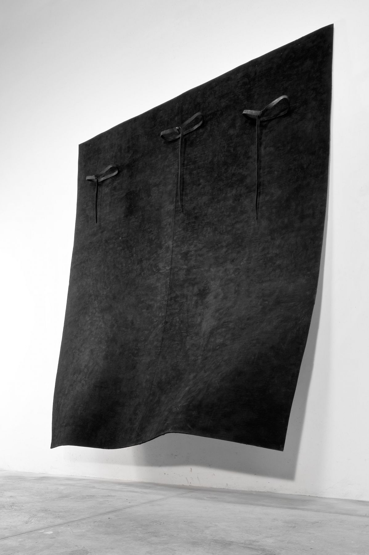 black painting by pier paolo calzolari