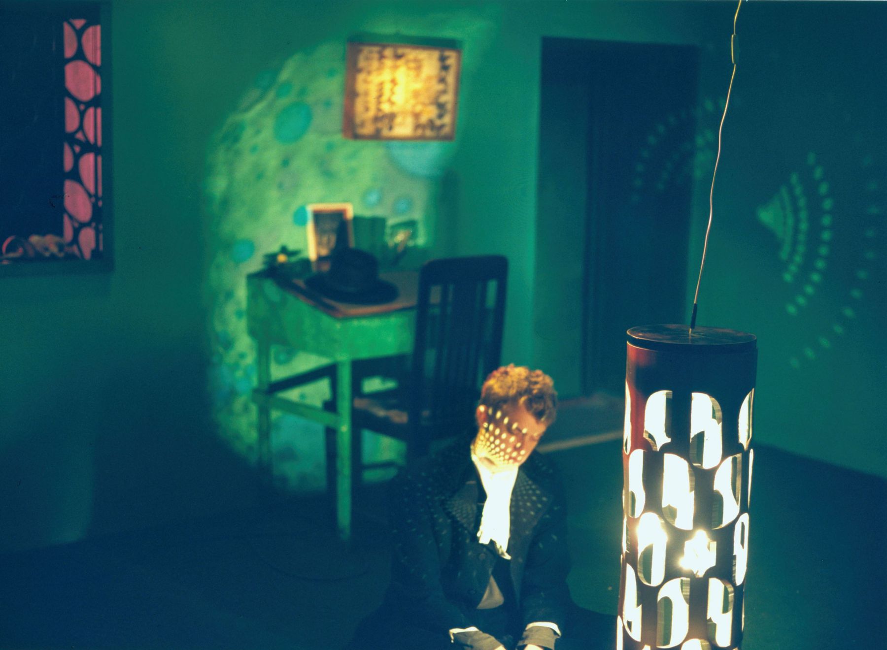 a photograph of a young boy in a room by contemporary photographer sue de beer