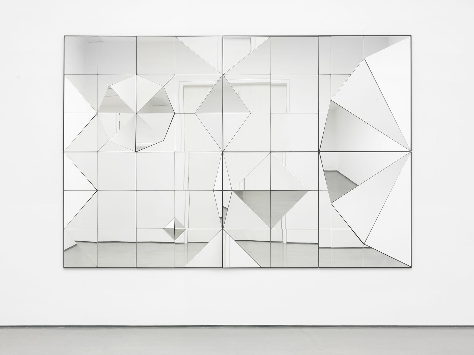 a mirror artwork of geometric shapes by female artist claudia wieser