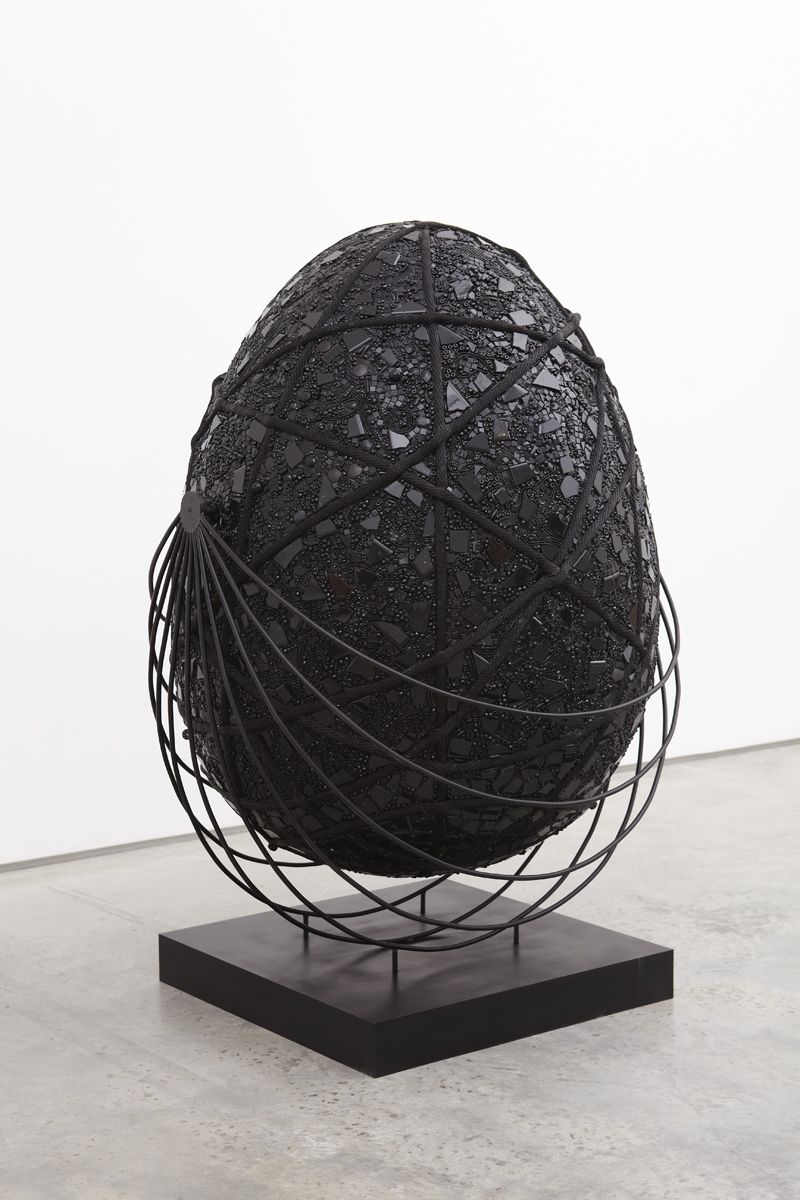 black egg shaped sculpture by mindy shapero