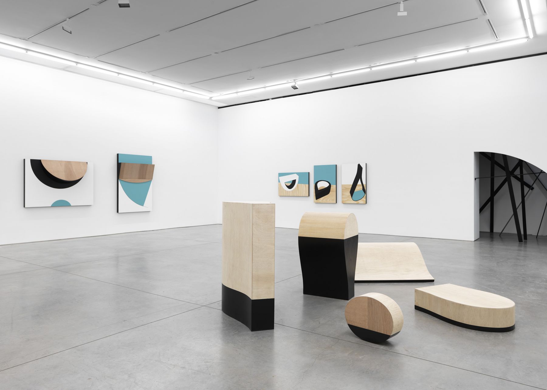 sculpture and artwork by serge alain nitegeka in a gallery