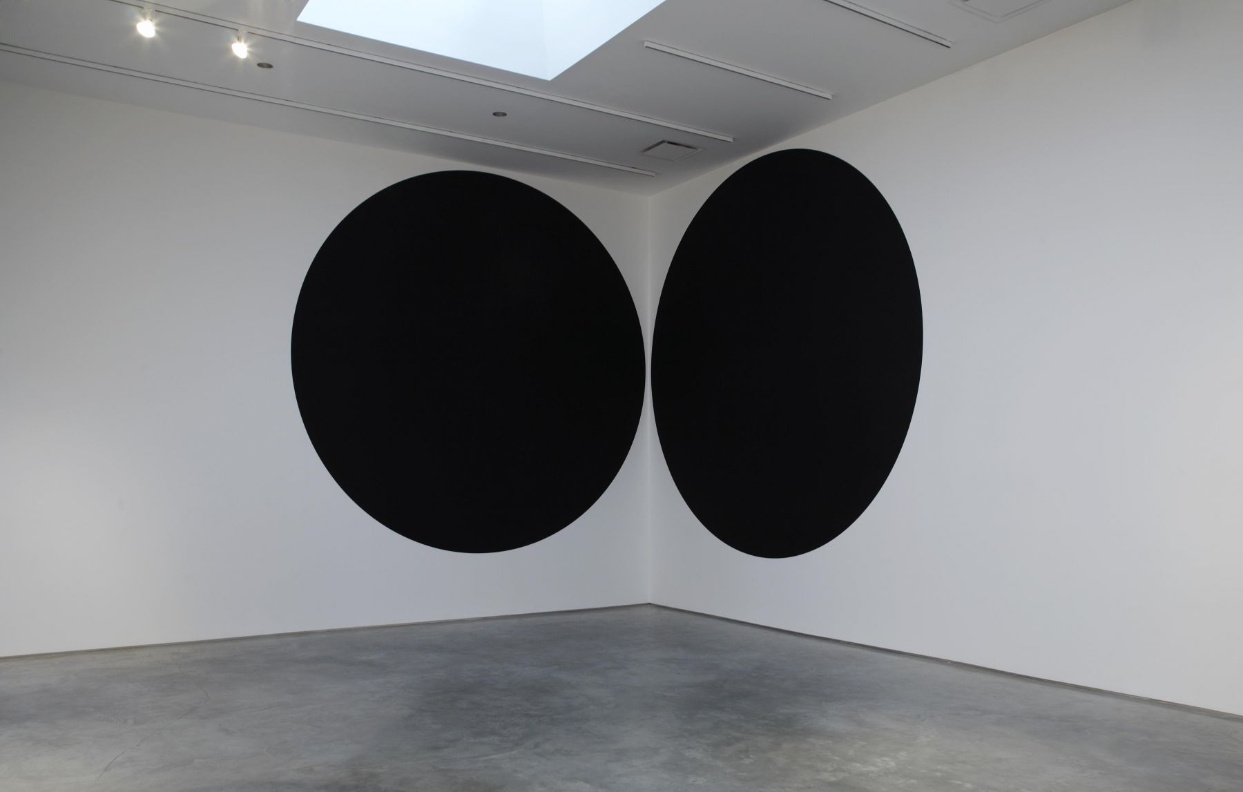 two black circles flanking corner by neil campbell