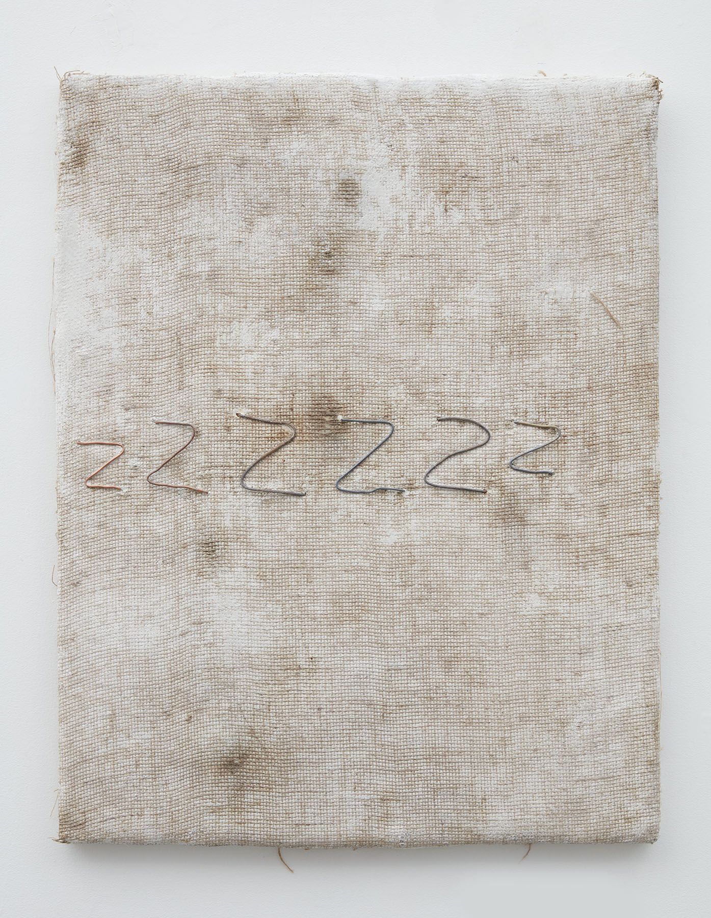 a cream-colored dyed burlap artwork by the minneapolis-based artist jay heikes