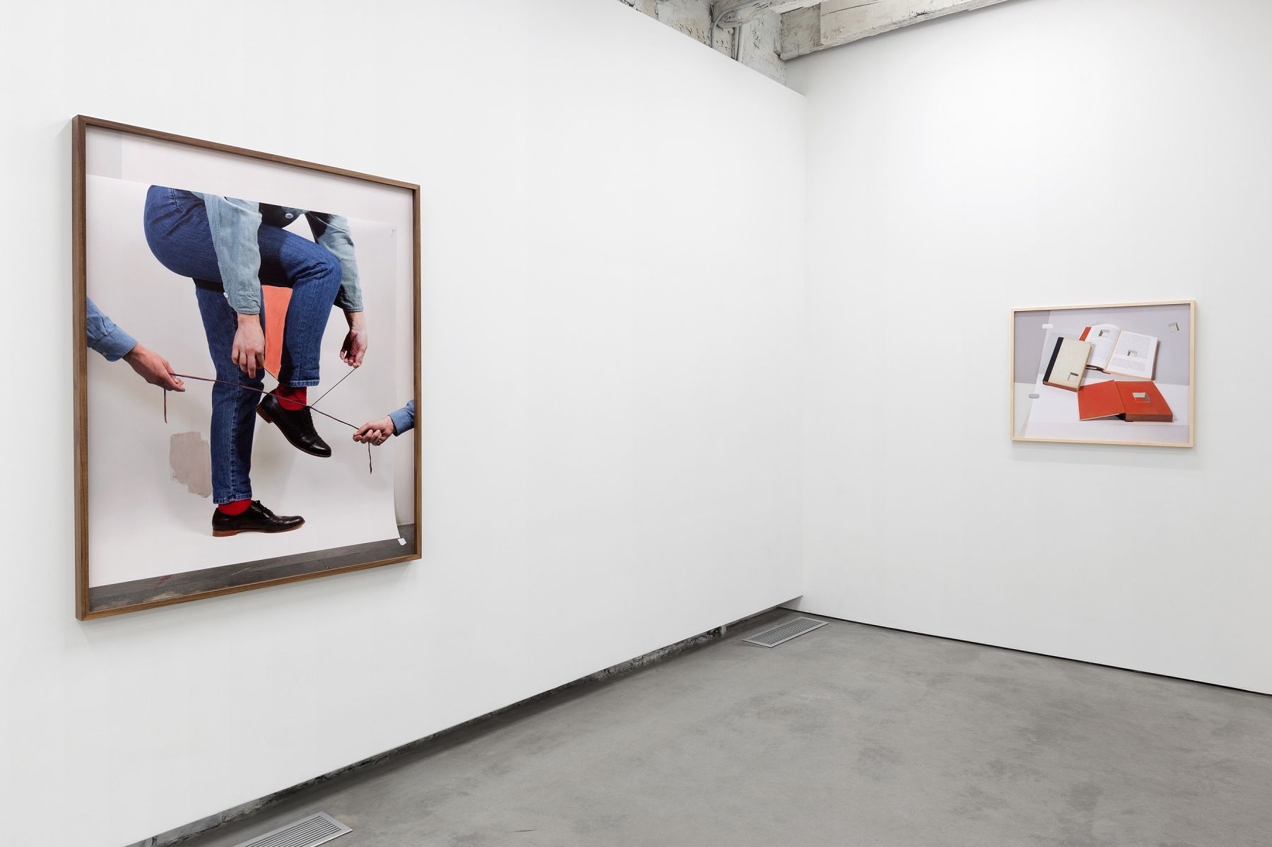 the exhibition in a contemporary art gallery featuring artworks by john houck