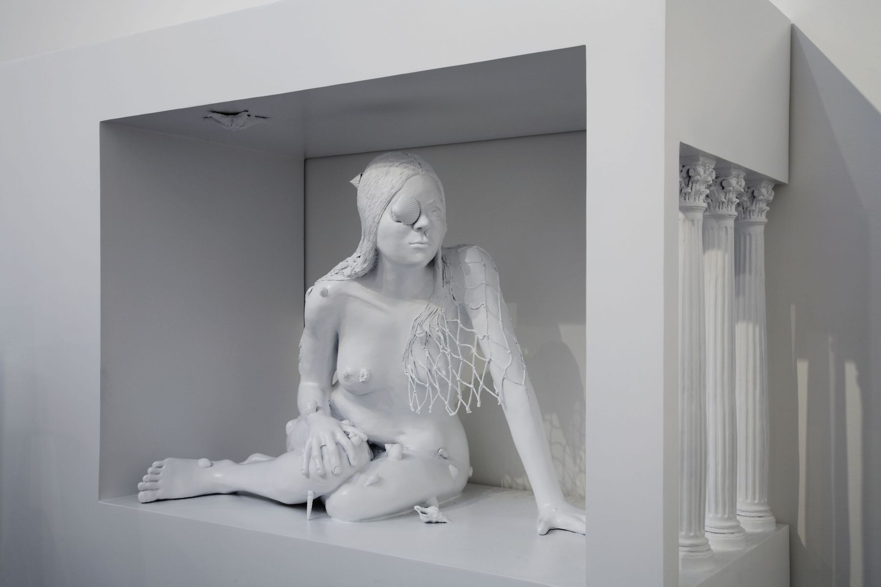 sculpture of a woman crouching by liz craft