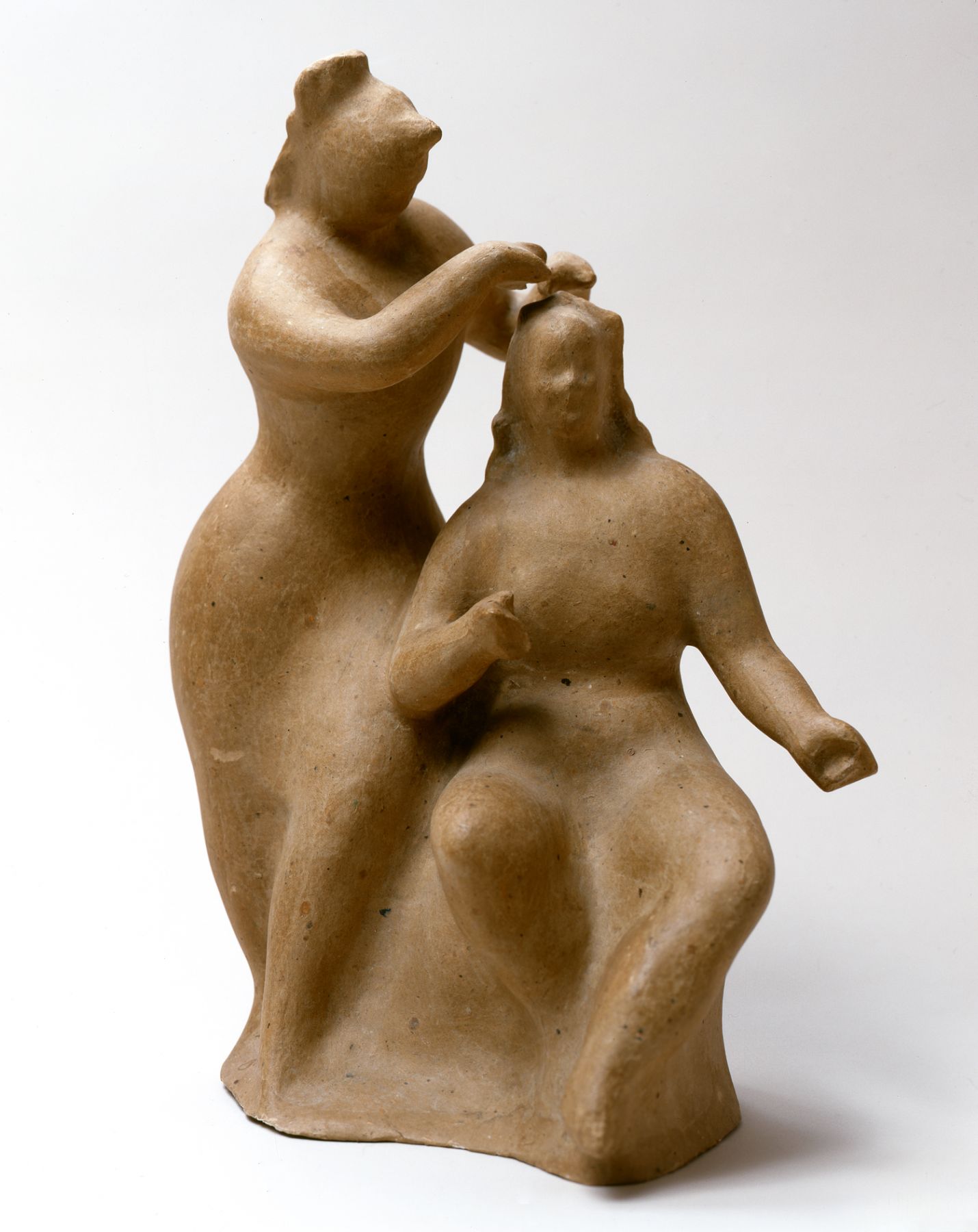 elie nadelman, Woman Dressing Another Woman's Hair, 1930's, cast papier-mâché, 14 1/2 inches high