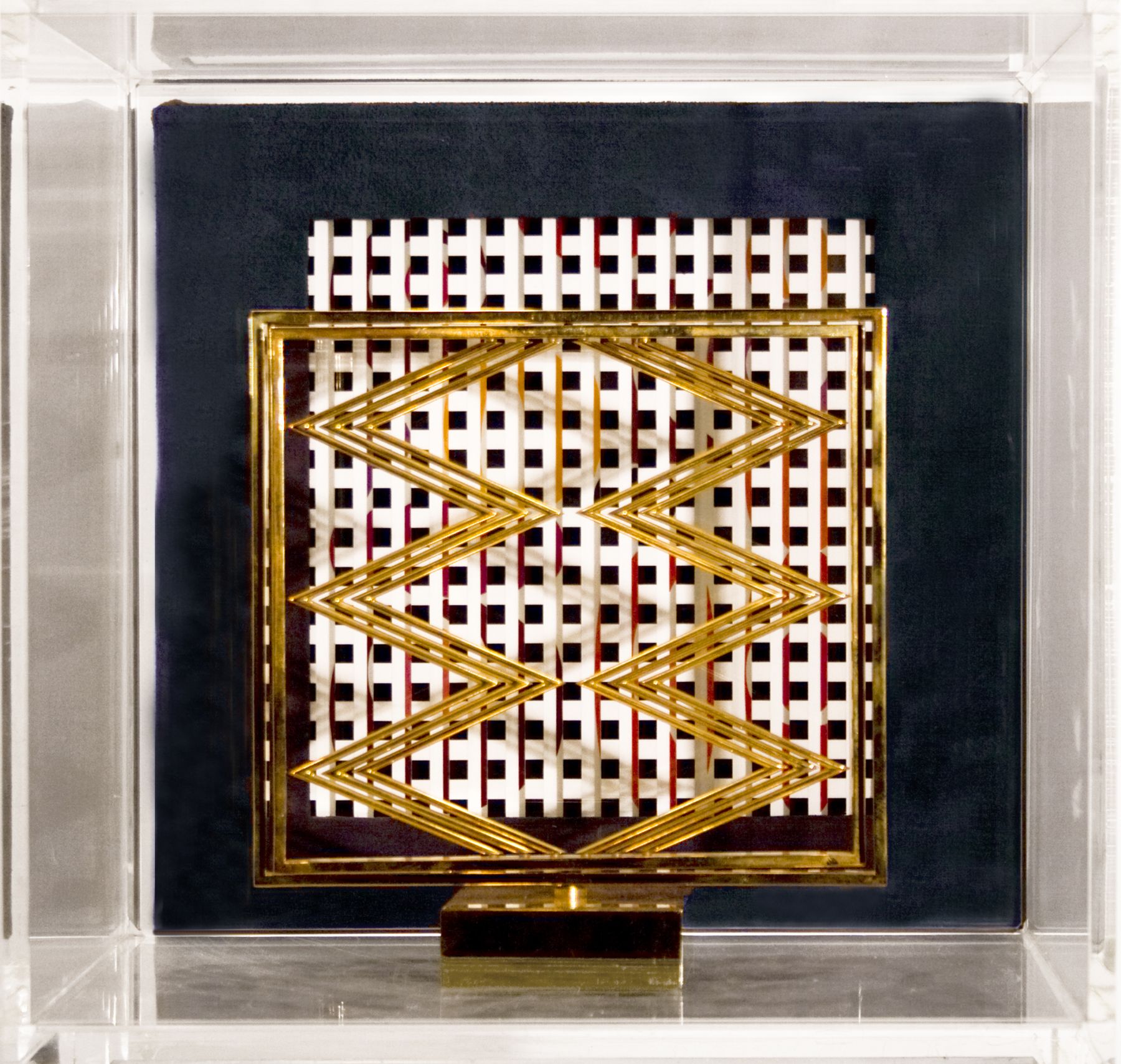 Yaacov Agam, Sens presence sens (SOLD), c.1976, polished bronze in Plexi case with book, sculpture: 8 x 8 x 8 inches, Plexi: 12 x 12 x 13 inches