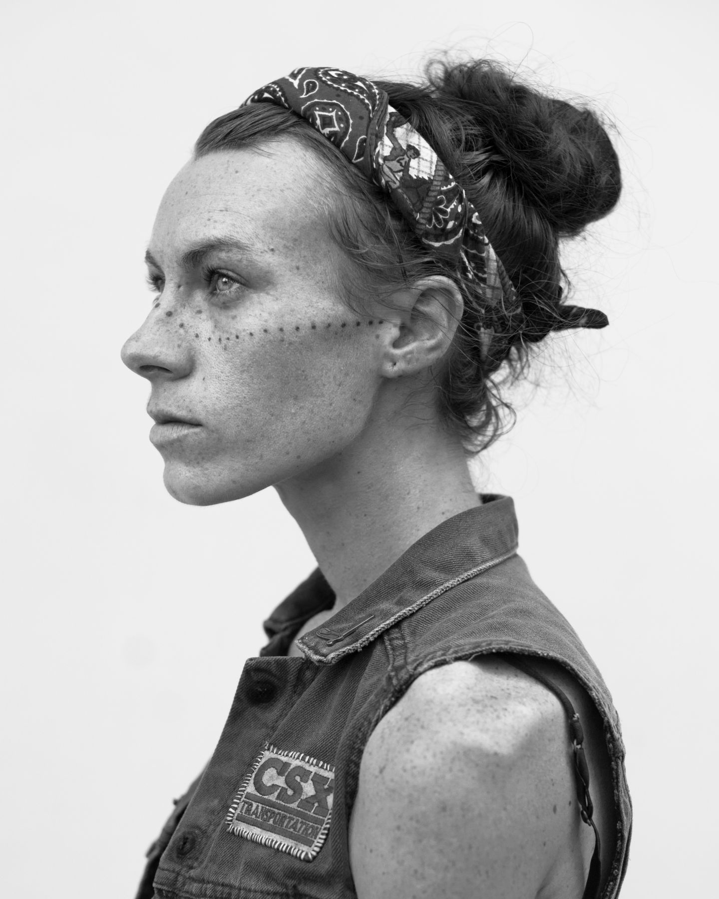 Woman with bandana and face tattoo by Michael Joseph