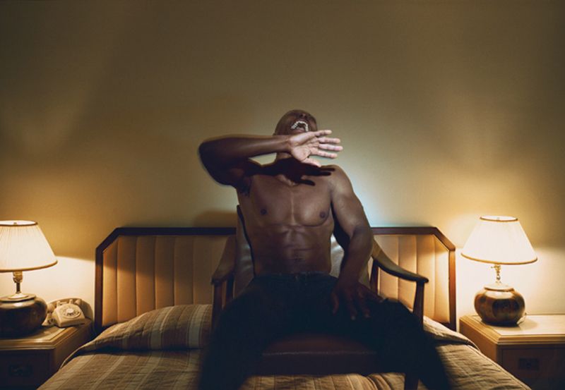 Man in hotel room by Philip-Lorca deCorcia