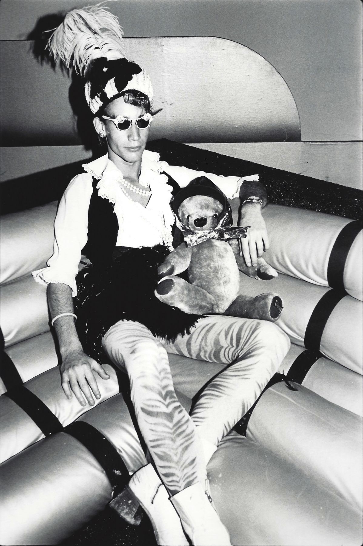 Young man with teddy bear by Arlene Gottfried