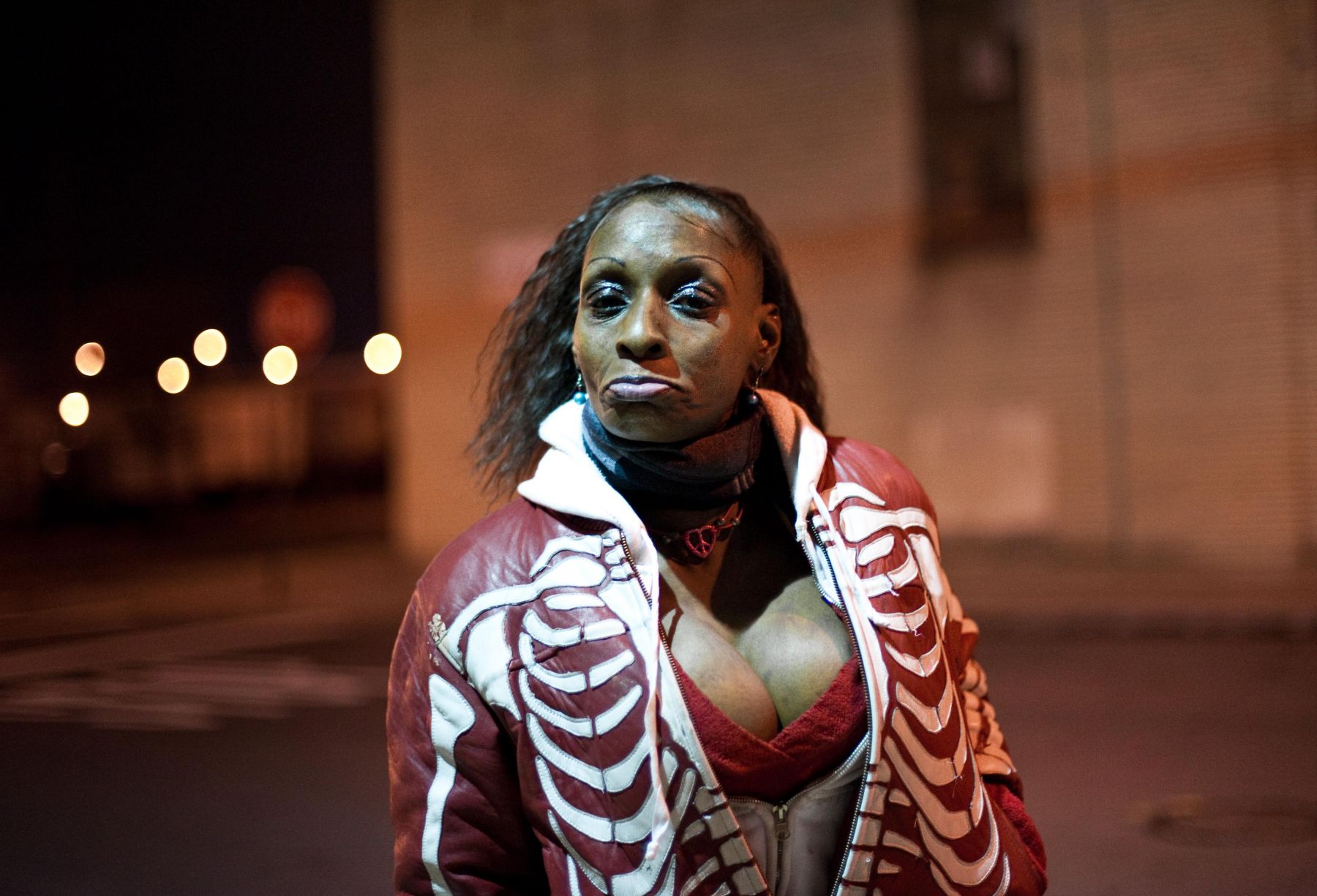 Woman at night by Chris Arnade