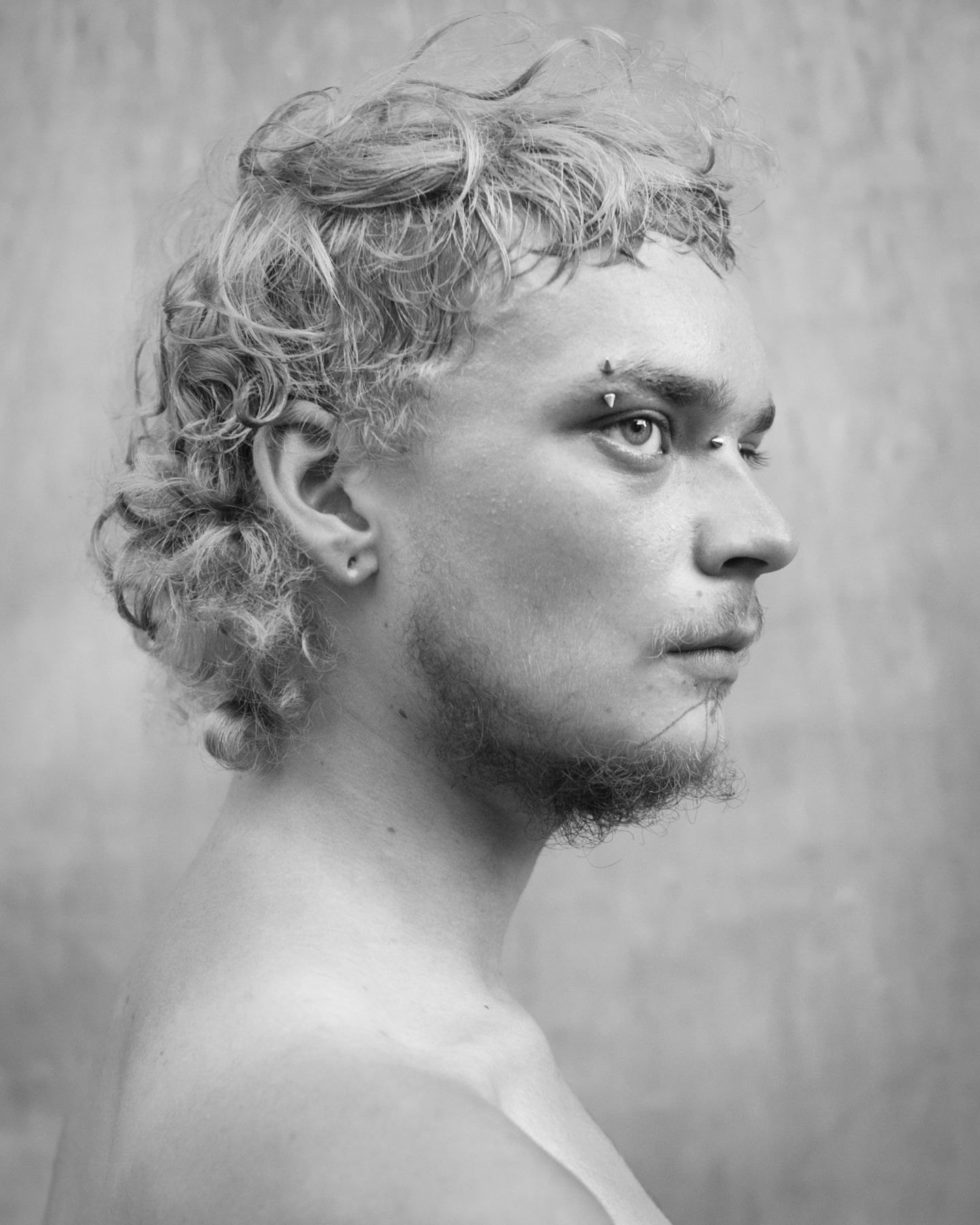 Man with piercings by Michael Joseph