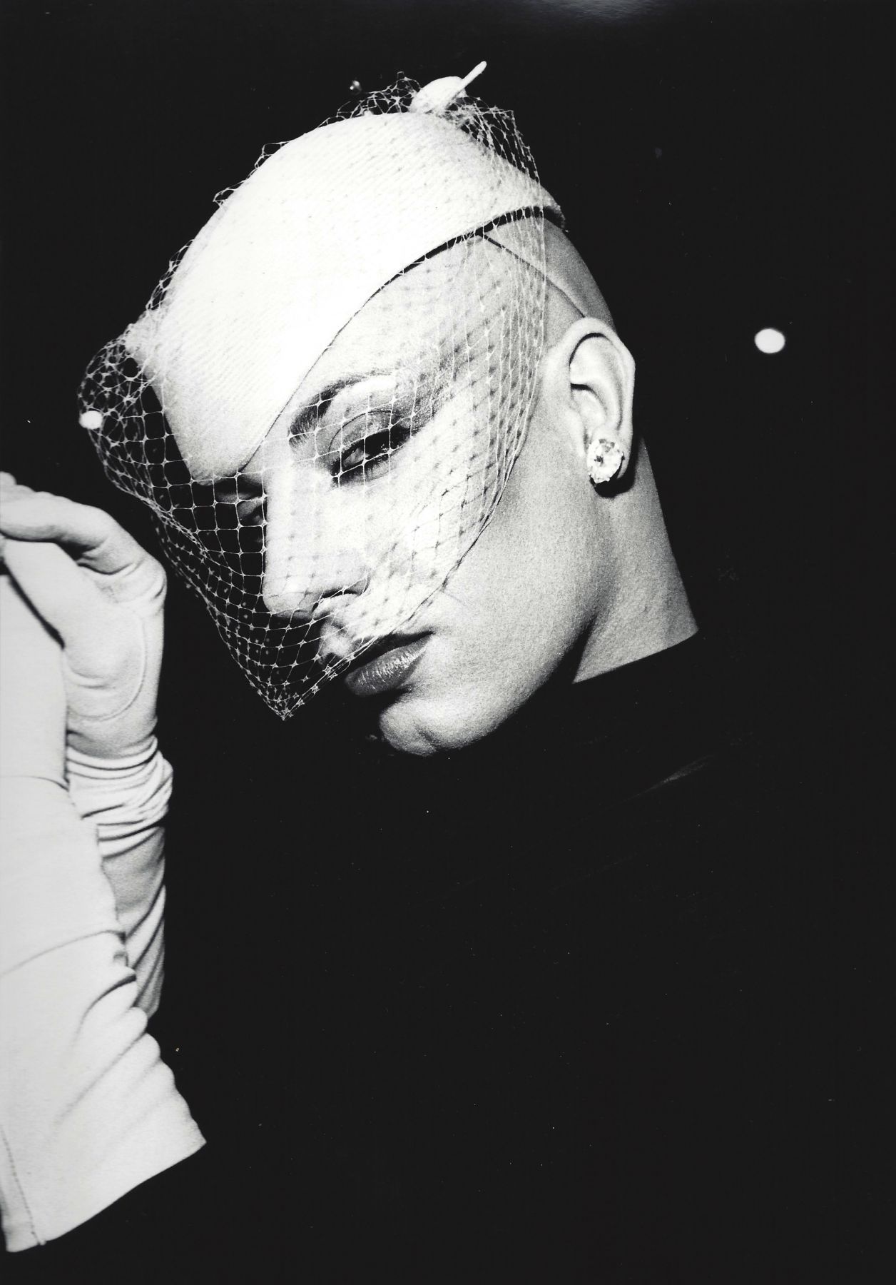Man in white veil by Arlene Gottfried