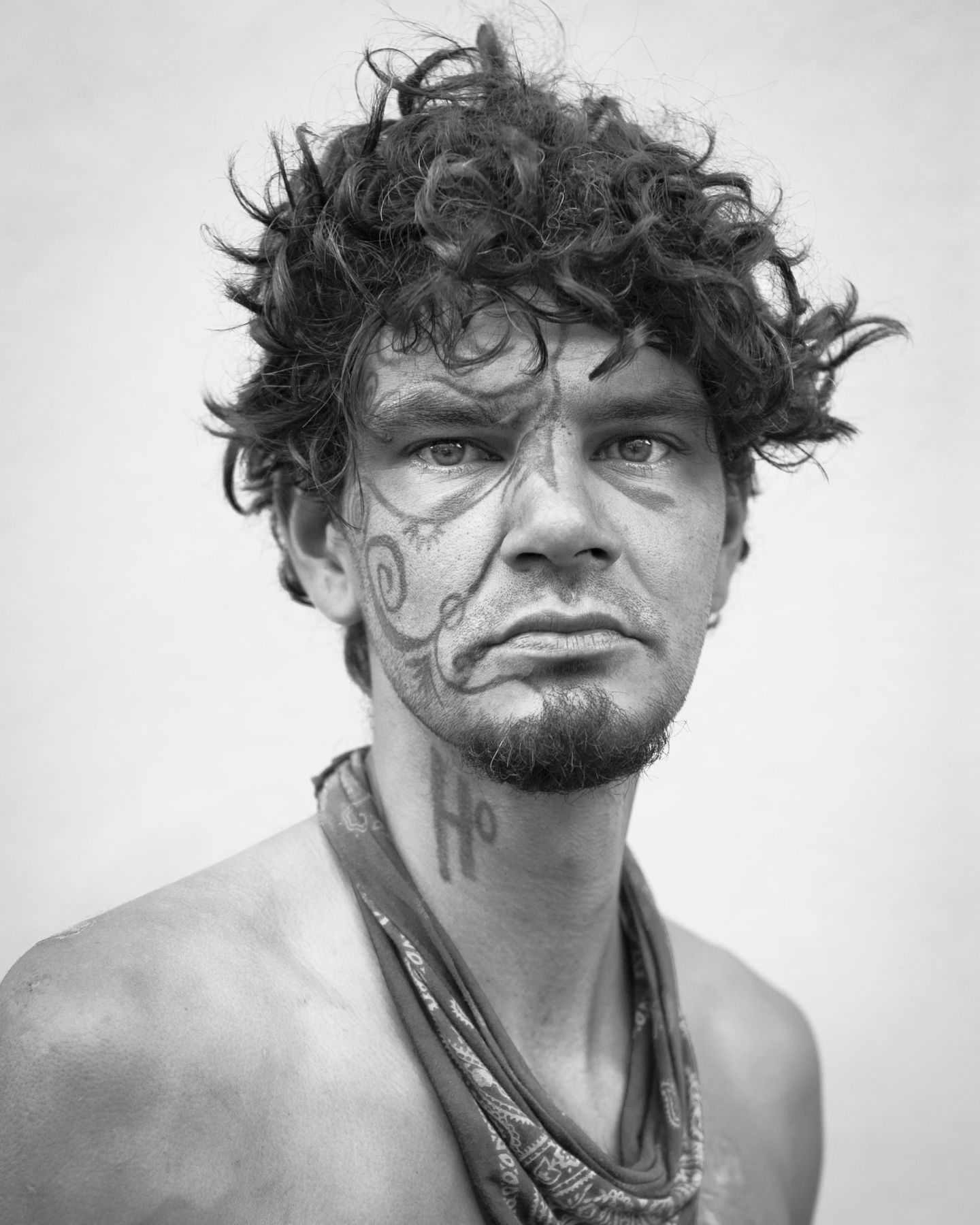 Man with face tattoo by Michael Joseph