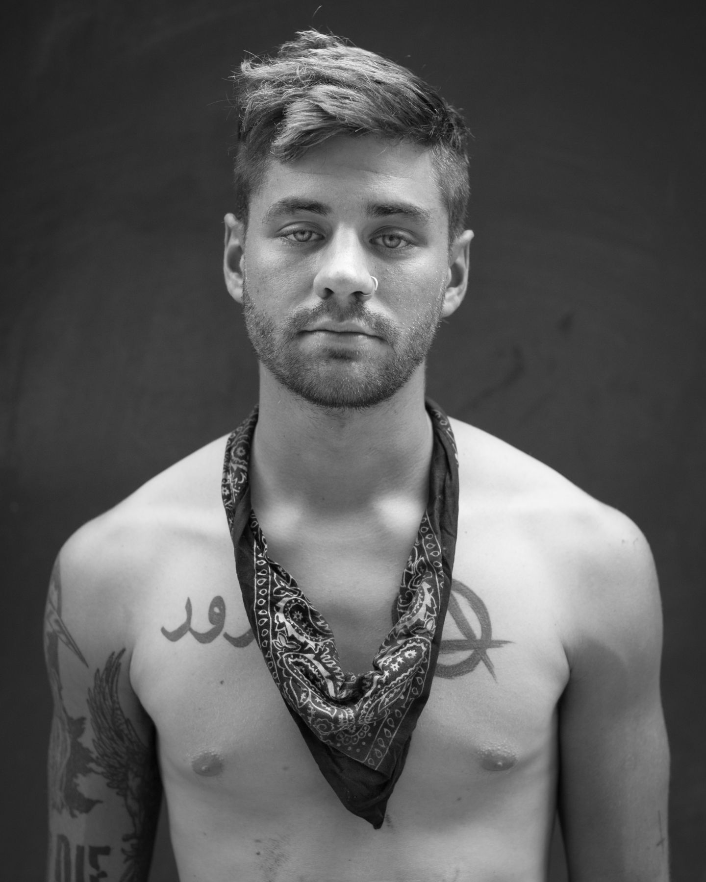 Young man with tattoos by Michael Joseph
