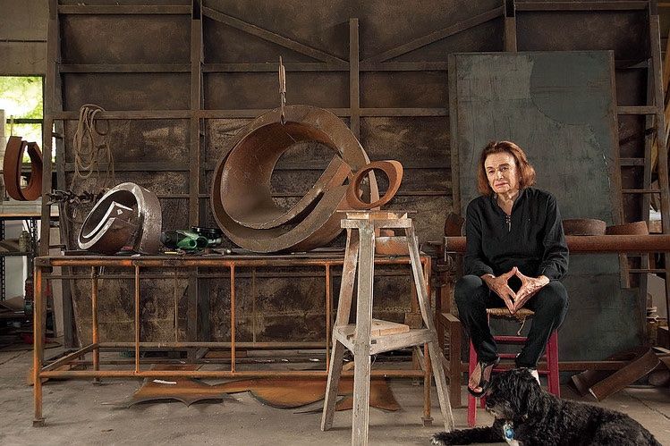 Portrait of Beverly Pepper with her work, Fallen Sky, 1968