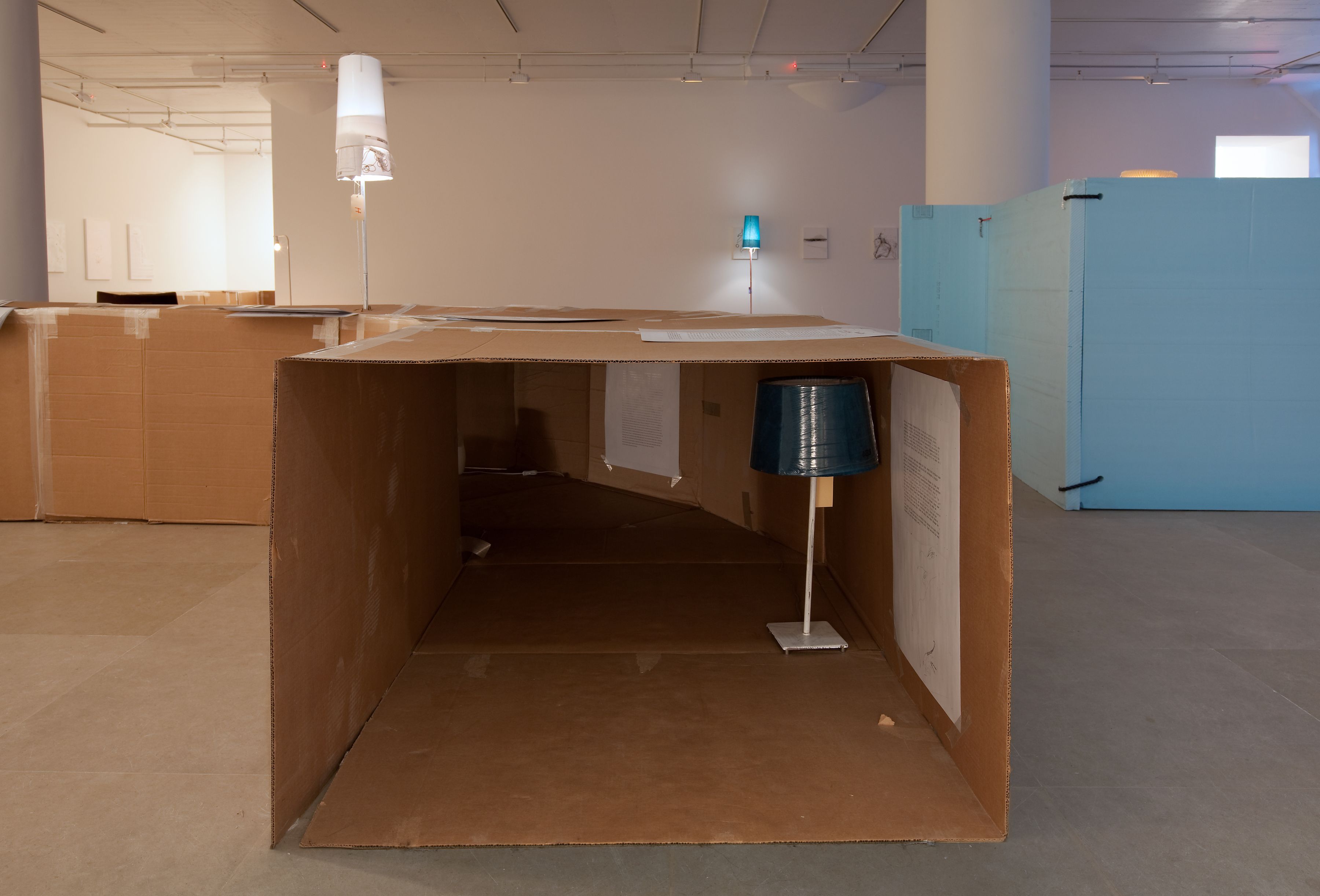 Josef Strau J: Inside the Letter-Hole (Josef for Children), 2008 (detail) Cardboard, tape, inkjet prints, mp3 players, mixed media lamps Overall: 29 x 116 x 270 inches (73.66 x 294.64 x 685.8 cm)
