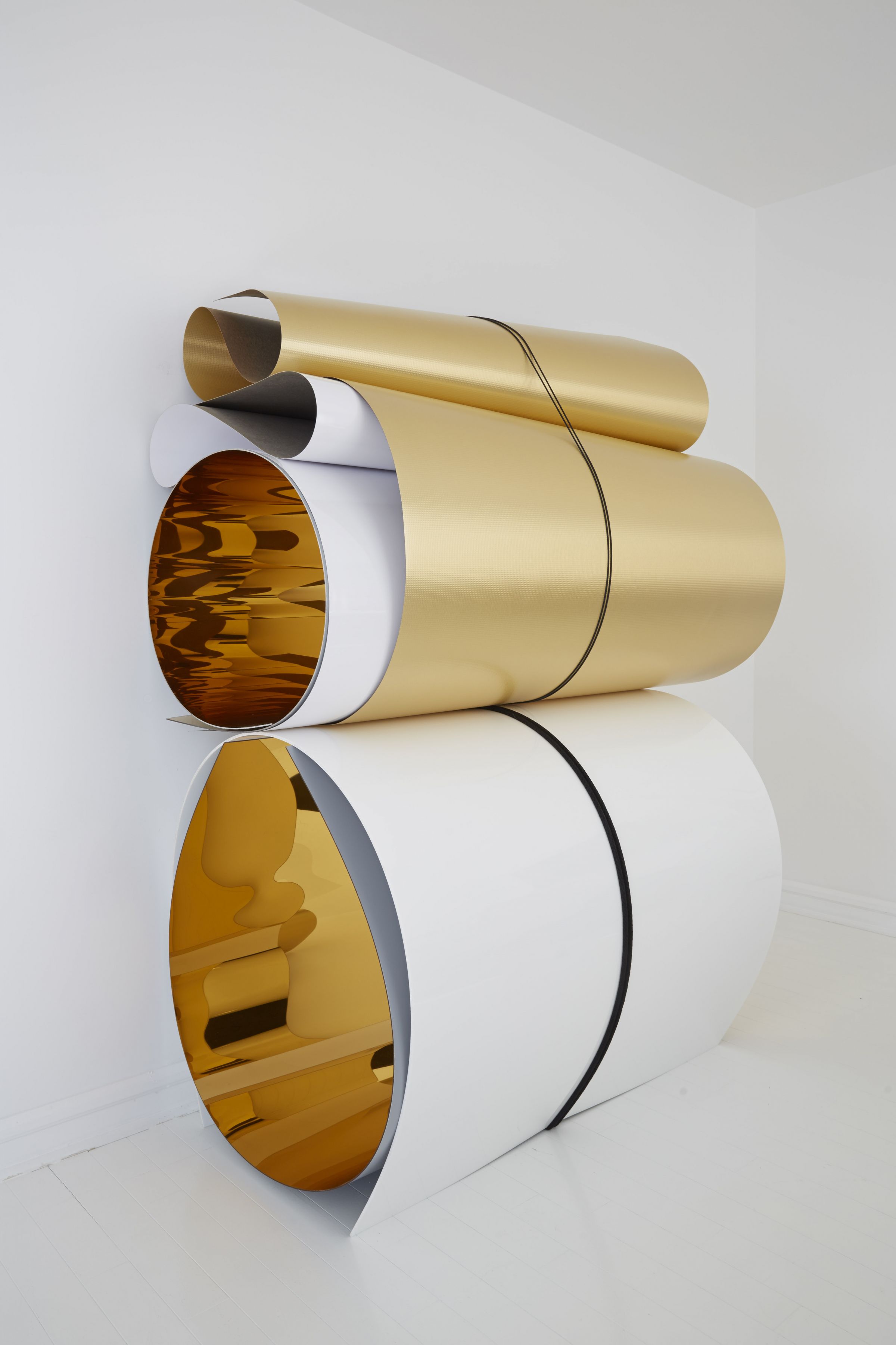 a sculpture of plexiglass and formica in rolls by Julia Dault