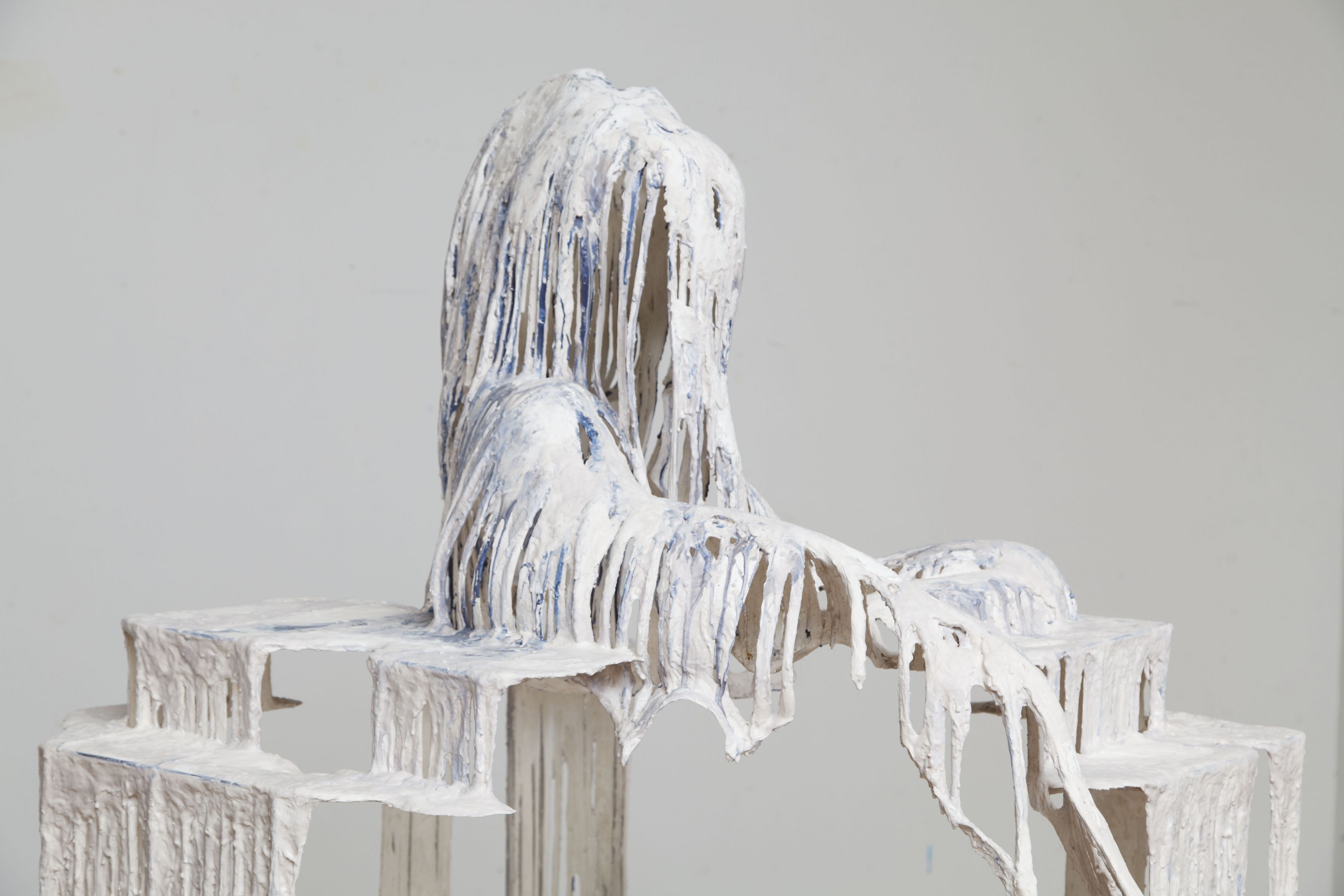a detail of a white drip sculpture by the artist Diana Al-Hadid available for purchase
