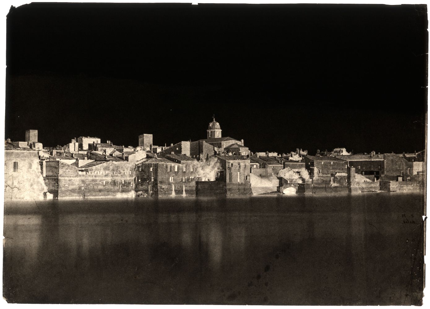 Charles NÈGRE (French, 1820-1880) View from the banks of the Rhône "Arles", 1852 Waxed paper negative with selectively applied pigment 23.7 x 33.1 cm Initialed "C.N." and titled "Arles." in black ink on verso
