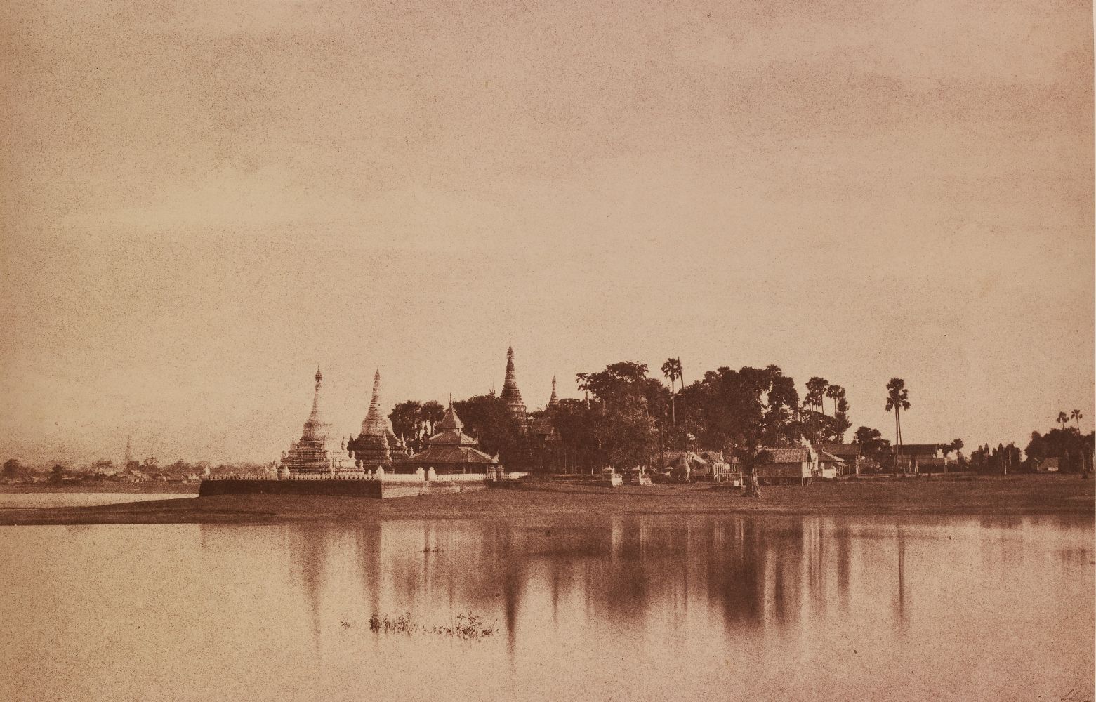 Captain Linnaeus TRIPE (English, 1822-1902) "No. 56. Amerapoora. View on the Lake.", September-October 1855 Albumenized salt print from a waxed paper negative 22.4 x 34.8 cm mounted on 45.6 x 58.3 cm paper Signed "L. Tripe" in ink. Photographer's blindstamp and printed label with plate number, title and "Taken from the causeway crossing the Toung-deman lake at its Eastern extremity. A glimpse of the city is caught on the left." on mount.
