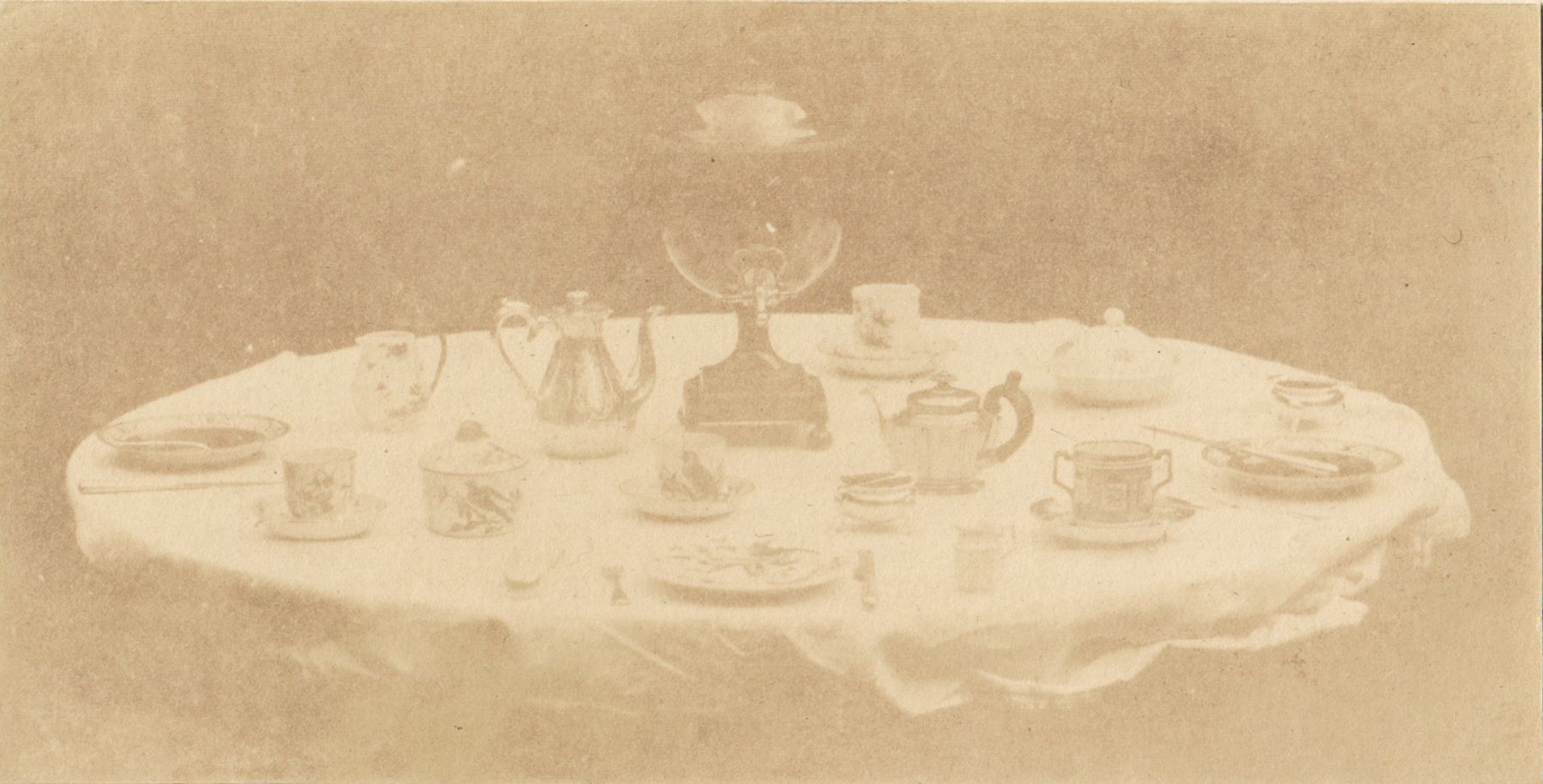 William Henry Fox TALBOT (English, 1800-1877) Table set for tea, 1841-1842 Varnished salt print from a calotype negative 8.5 x 16.8 cm mounted on card, ruled "Patent Talbotype Photogenic Drawing" label on mount verso