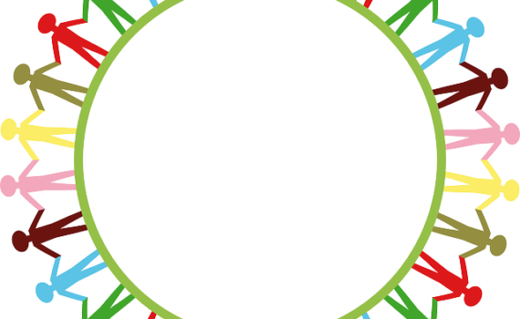 people holding hands around globe