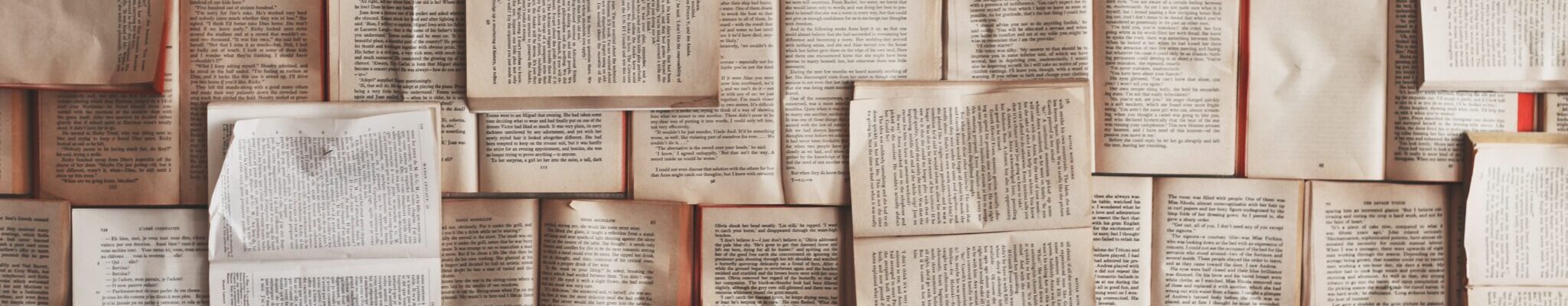 A large stack of open books
