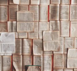 A large stack of open books