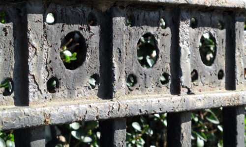 weathered black iron gates