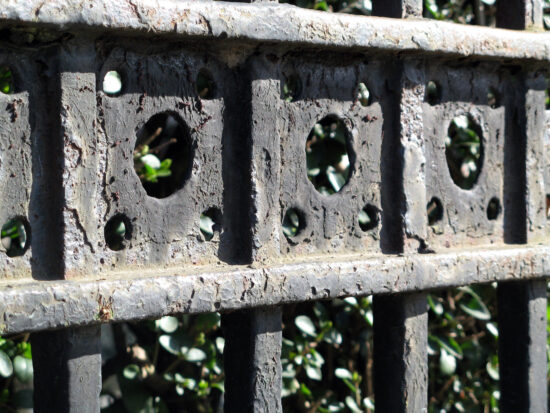 weathered black iron gates