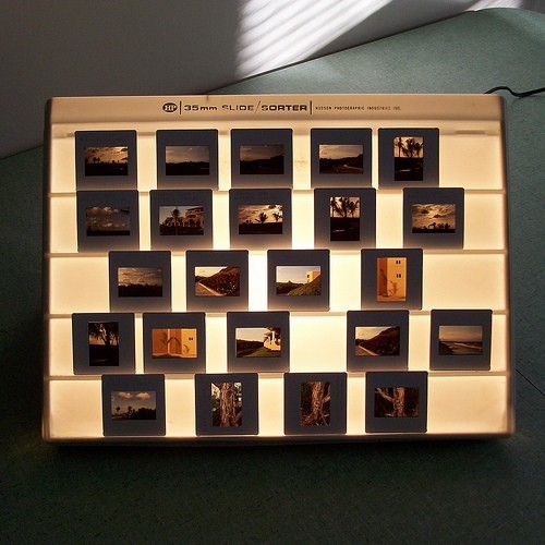 An image of a nicely organized set of 35mm slides on a vintage slide sorter