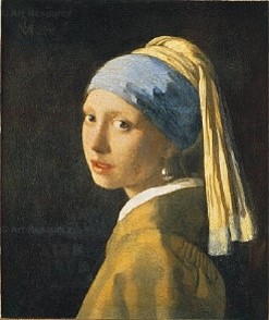 The painting known as, Girl with a Pearl Earring, by Johannes Vermeer which shows the head and torso of a girl looking towards the viewer