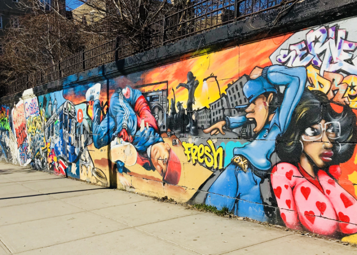 Mural in the Bronx depicting street art and gentrification in the Bronx.